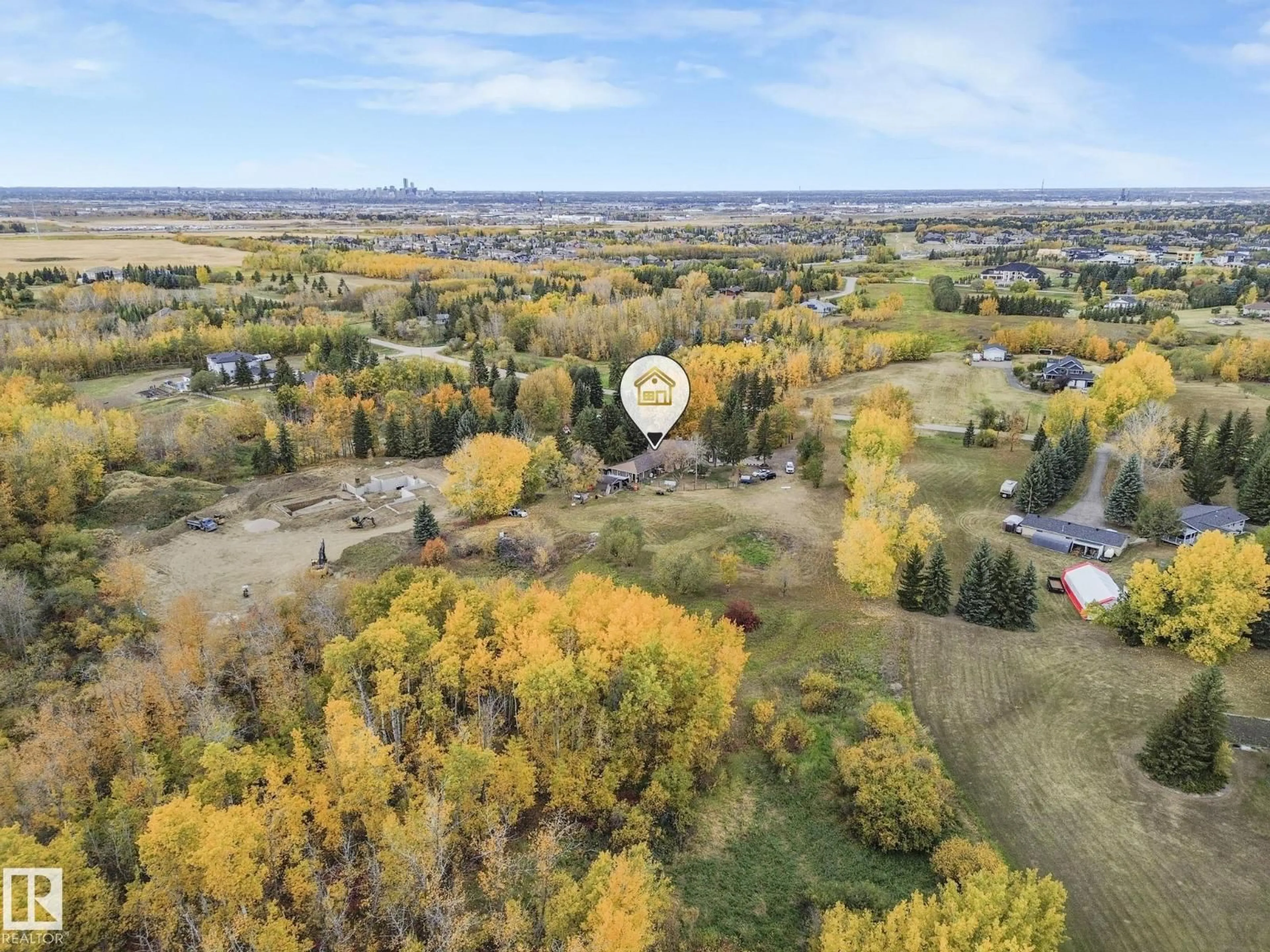 A pic from outside/outdoor area/front of a property/back of a property/a pic from drone, forest/trees view for 37 - 52249 RANGE ROAD 233, Rural Strathcona County Alberta T8B1C7