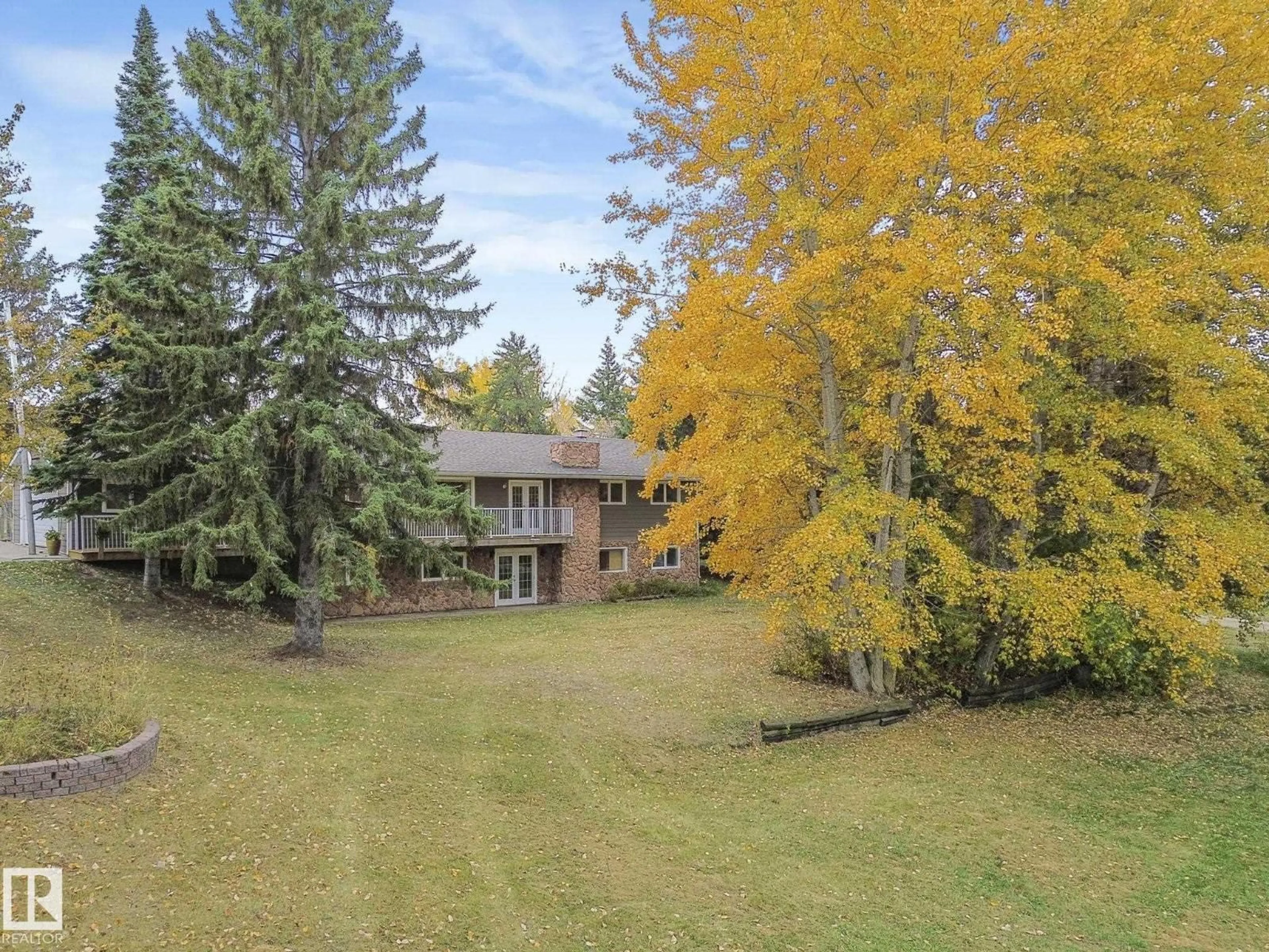 A pic from outside/outdoor area/front of a property/back of a property/a pic from drone, forest/trees view for 37 - 52249 RANGE ROAD 233, Rural Strathcona County Alberta T8B1C7