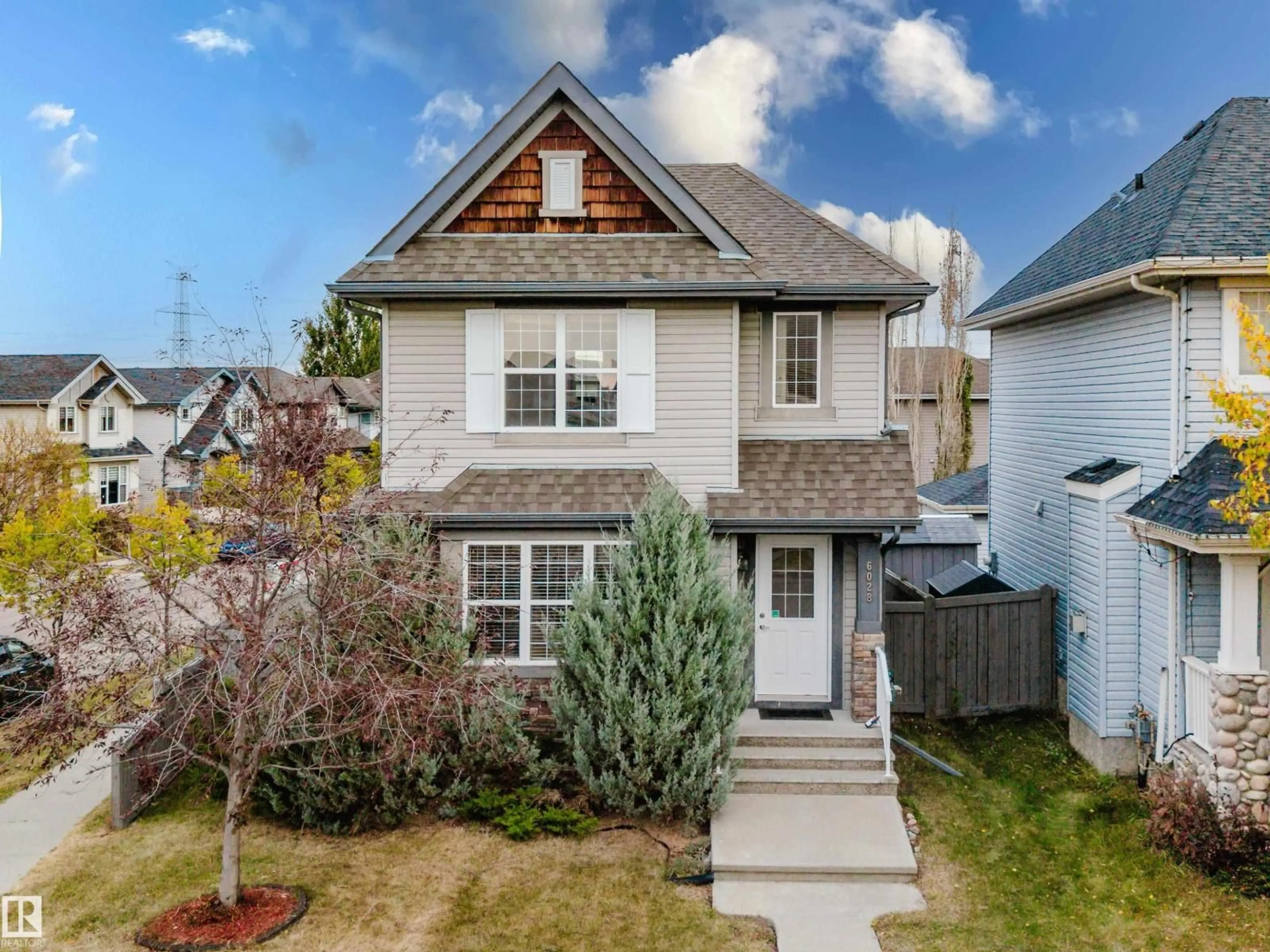 Home with vinyl exterior material, street for 6028 3 AV SW, Edmonton Alberta T6X0E6