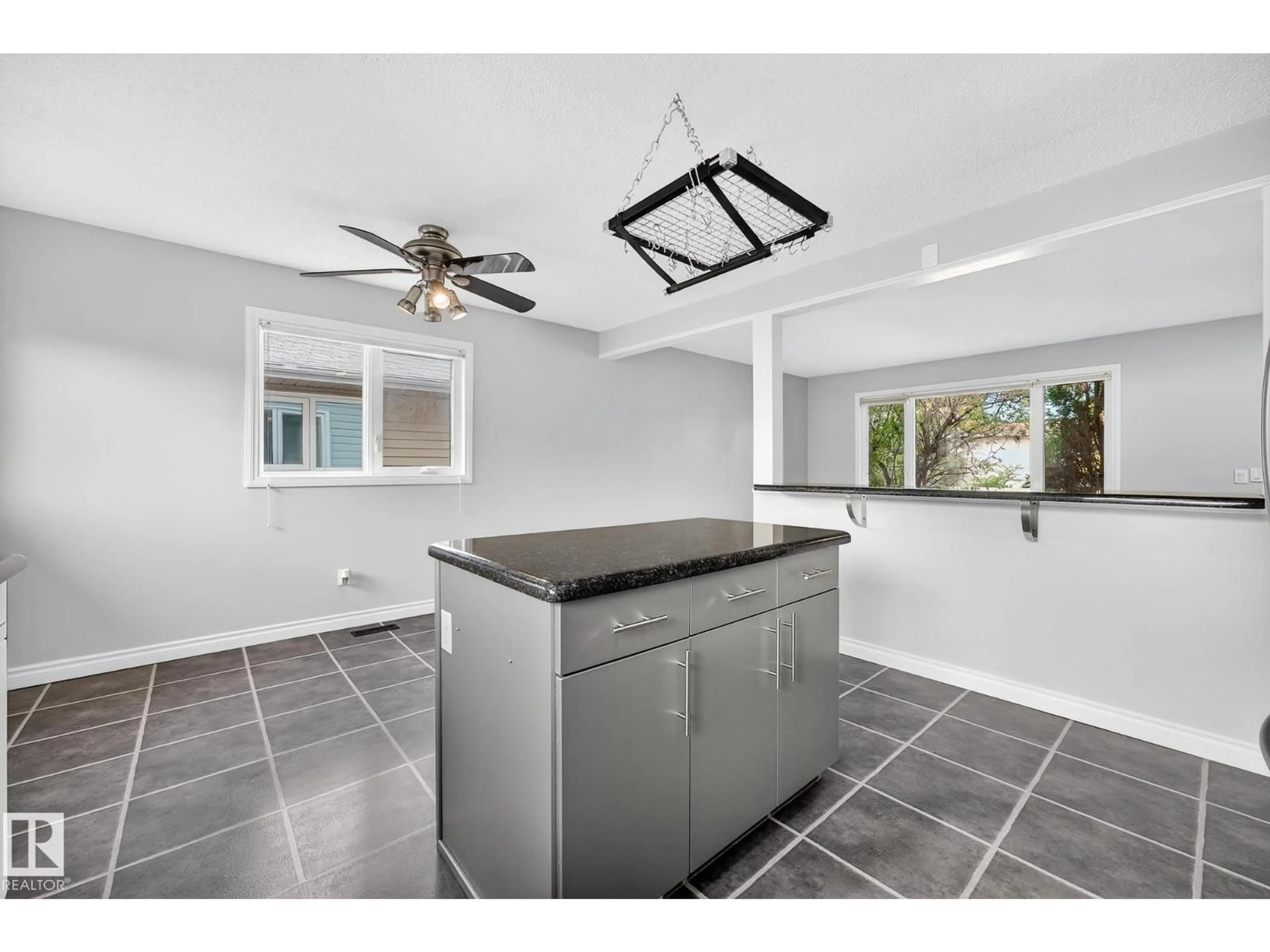 Open concept kitchen, ceramic/tile floor for 11423 35A AV, Edmonton Alberta T6J2G3