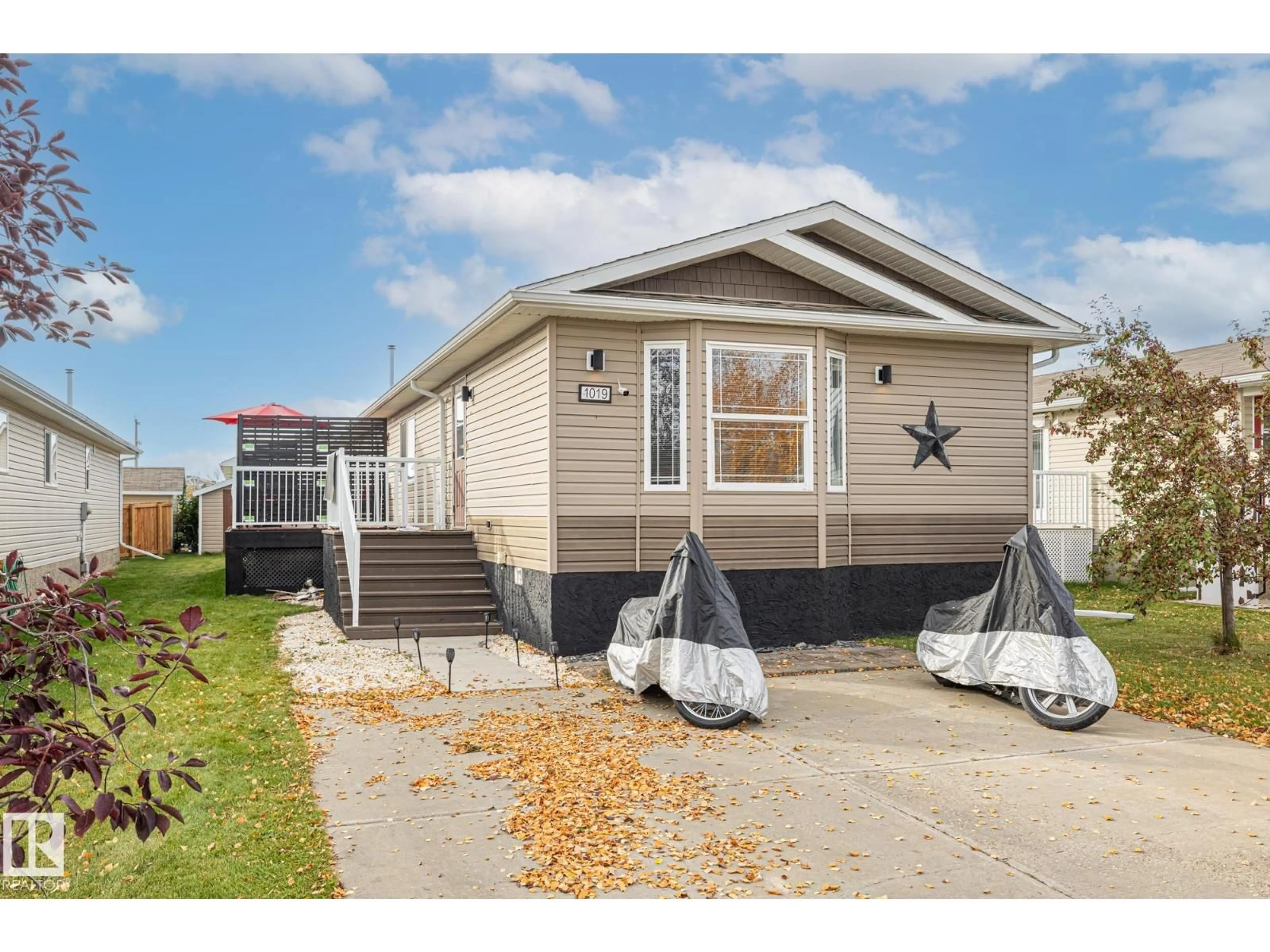 Home with vinyl exterior material, street for E - 1019 ASPEN DR, Leduc Alberta T9E8R5