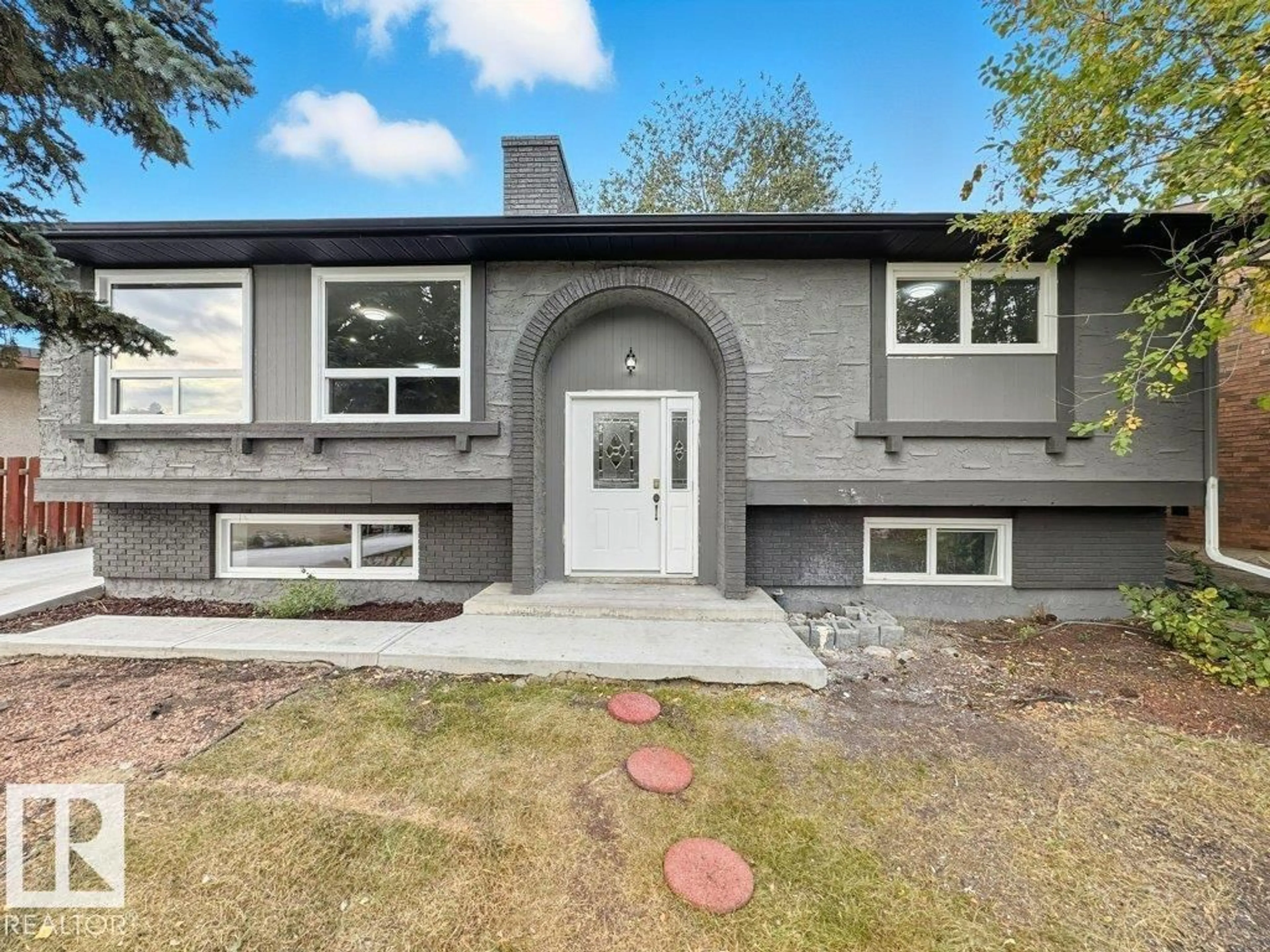 Home with vinyl exterior material, street for 18429 91 AVE NW, Edmonton Alberta T5T1N8