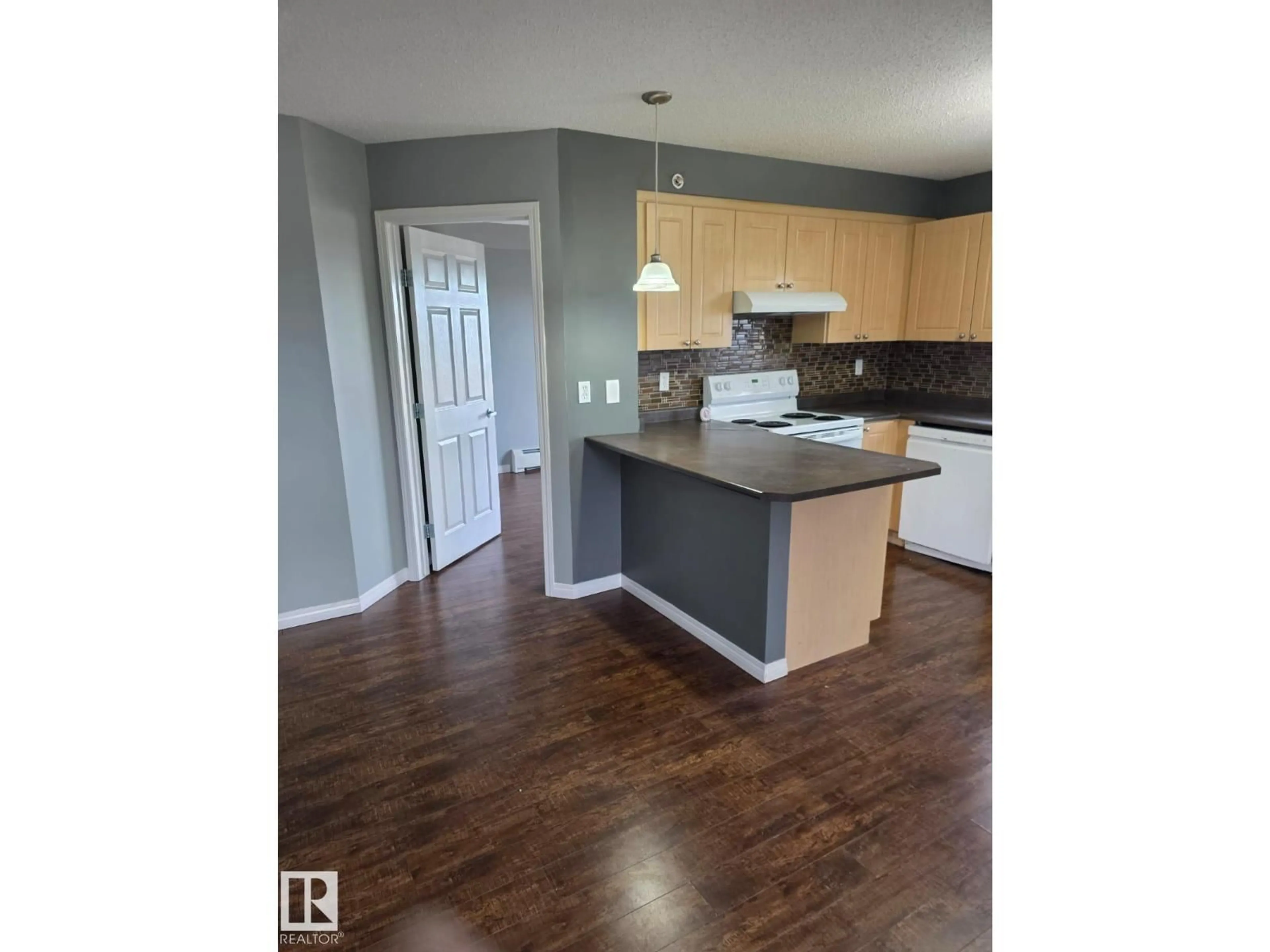 Open concept kitchen, wood/laminate floor for #402 - 622 MCALLISTER LO, Edmonton Alberta T6W1N2
