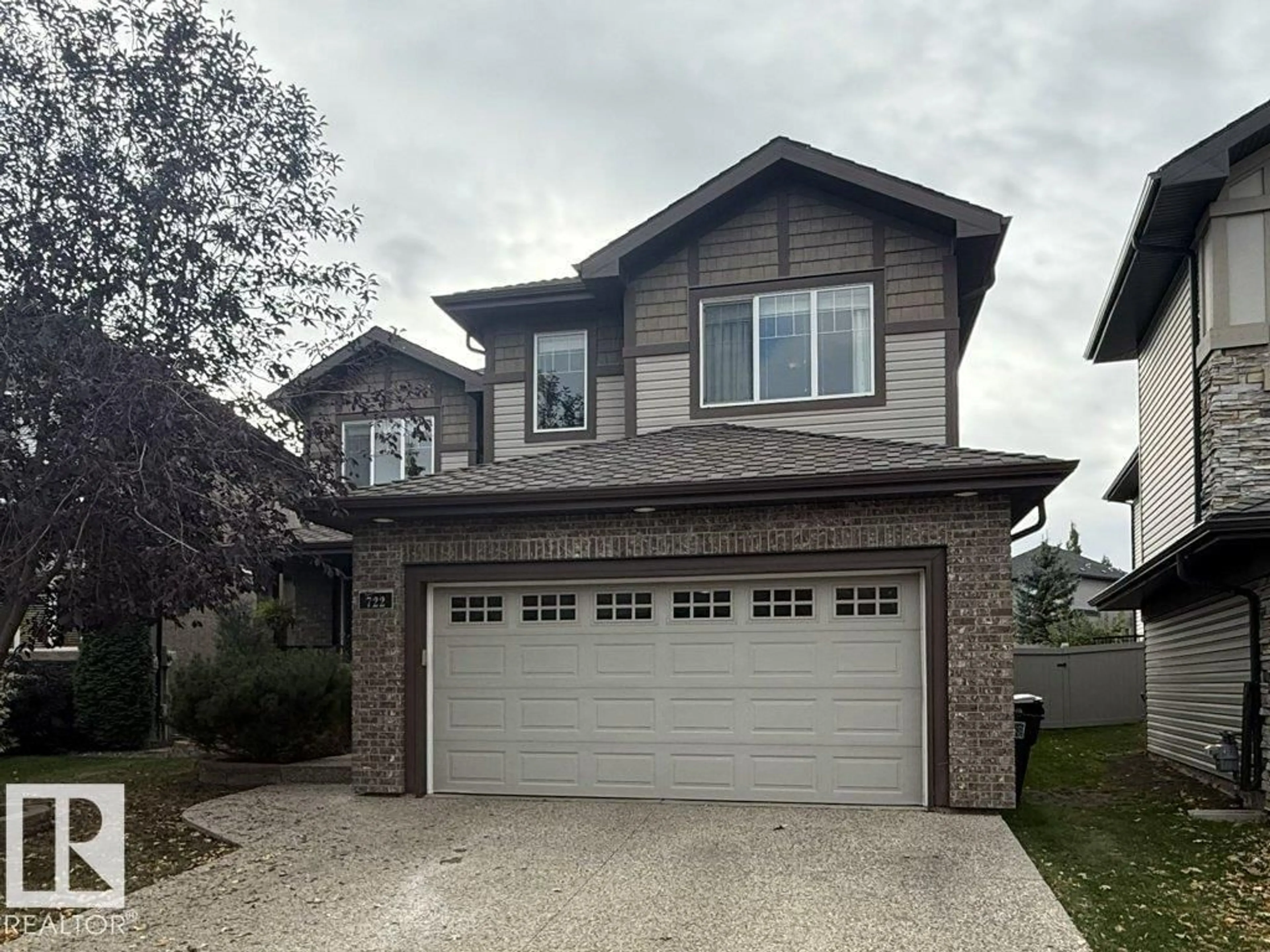 Home with vinyl exterior material, street for 722 CAINE BV, Edmonton Alberta T6W0R4