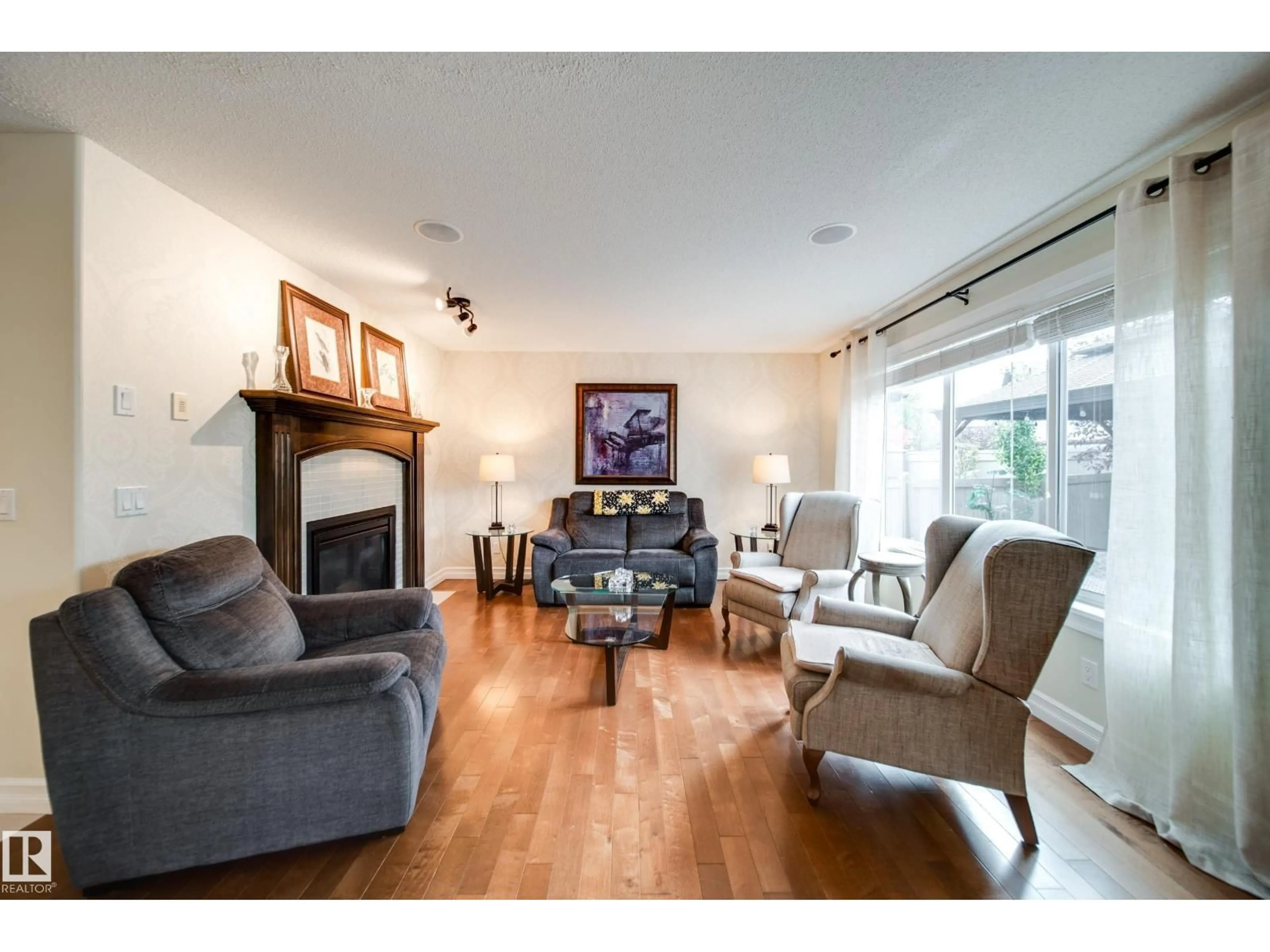 Living room with furniture, wood/laminate floor for 722 CAINE BV, Edmonton Alberta T6W0R4