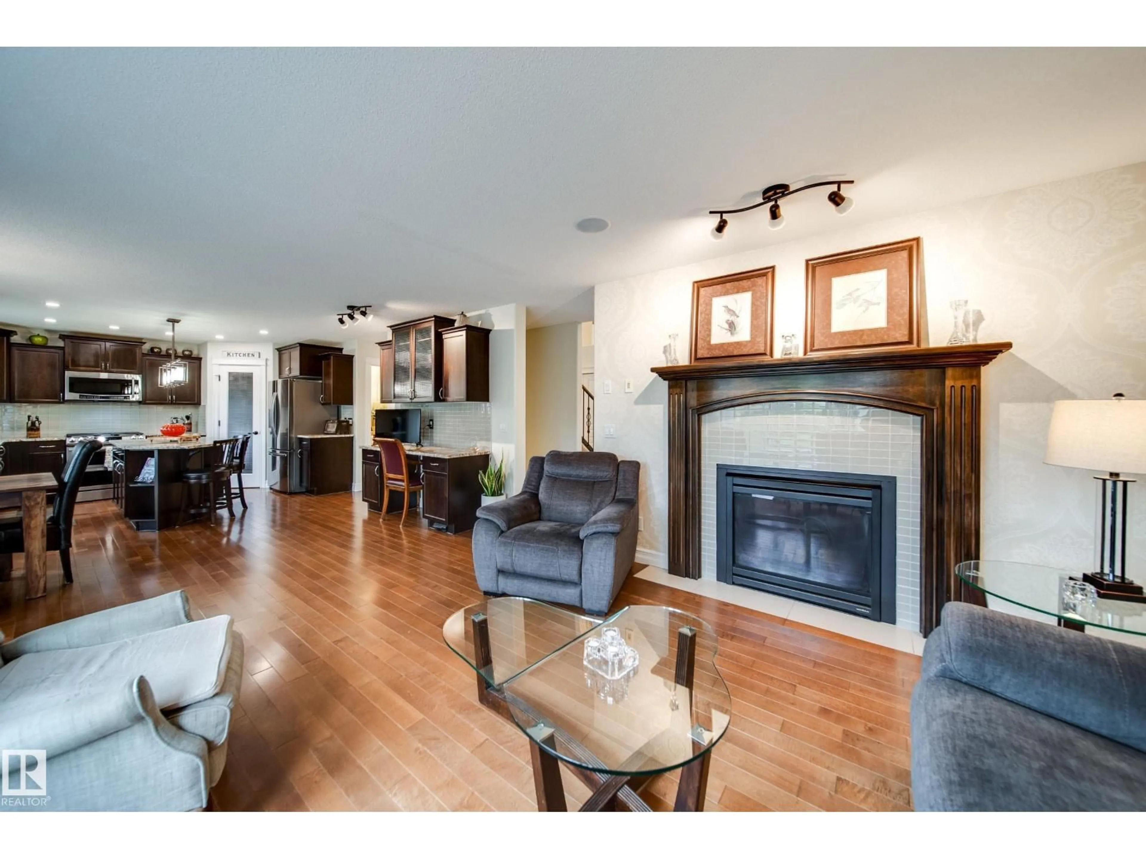 Living room with furniture, wood/laminate floor for 722 CAINE BV, Edmonton Alberta T6W0R4