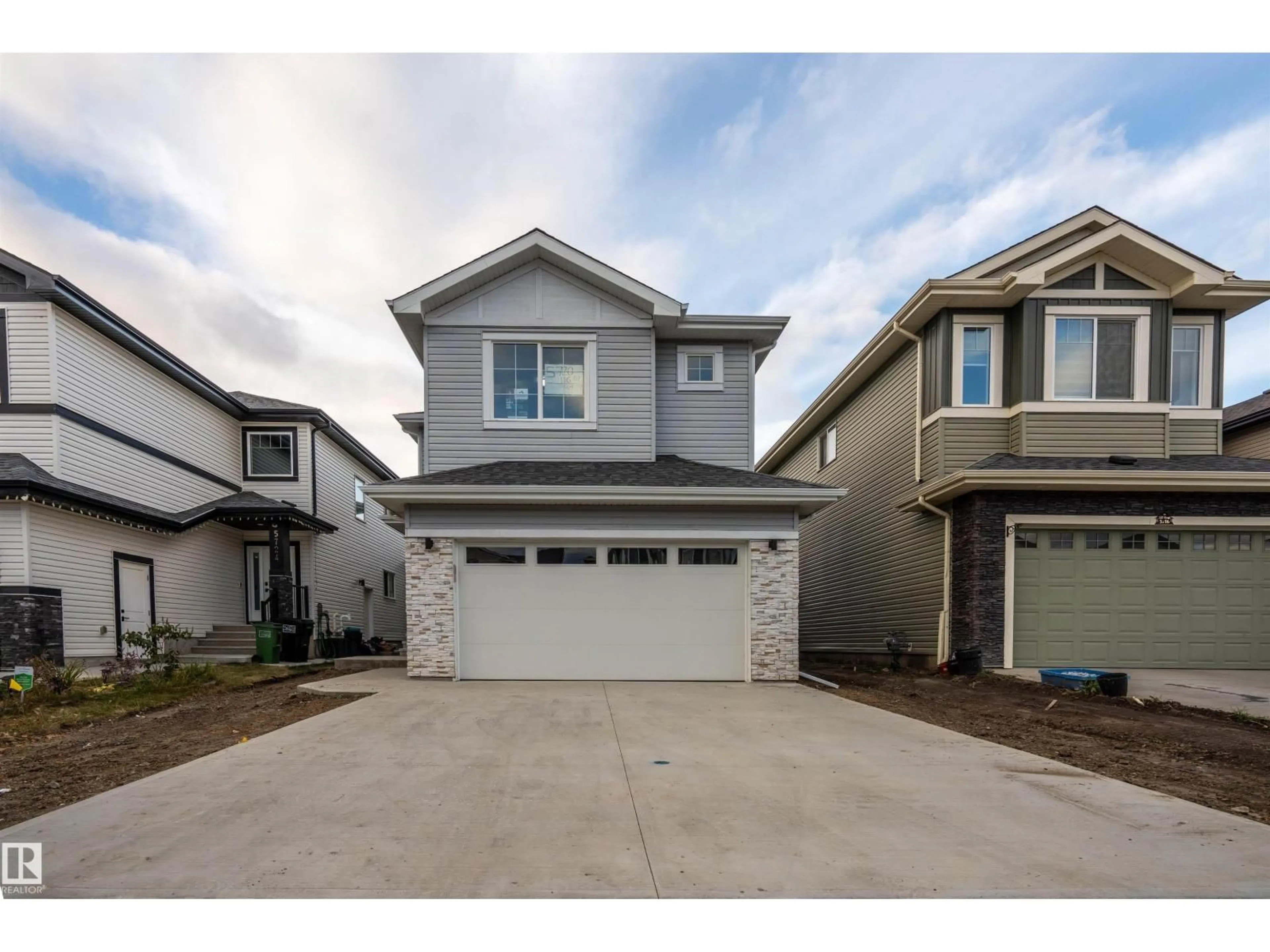 Home with vinyl exterior material, street for 5720 176 AV, Edmonton Alberta T5Y0K8
