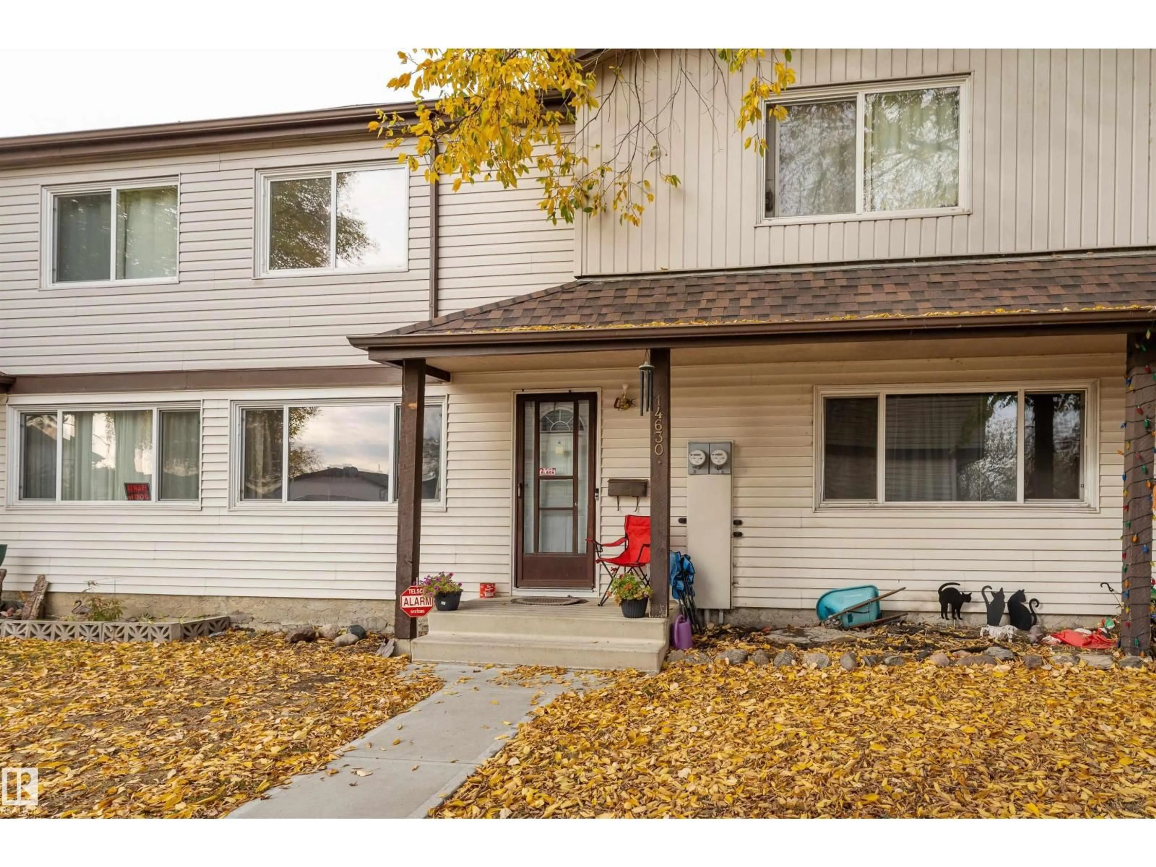 Home with vinyl exterior material, street for NW - 14630 54 ST, Edmonton Alberta T5A4L5