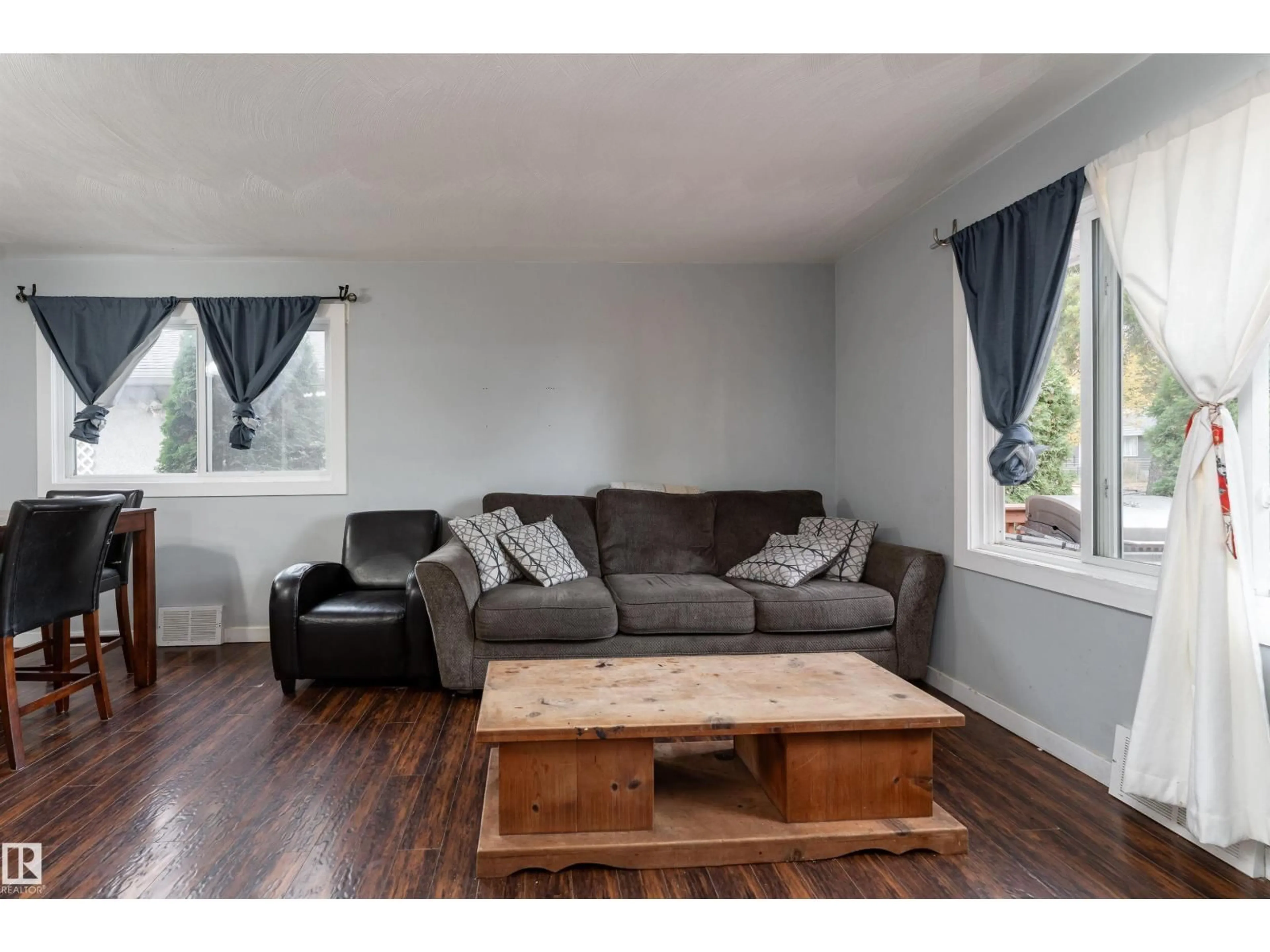 Living room with furniture, wood/laminate floor for 12316 140 ST, Edmonton Alberta T5L2C8