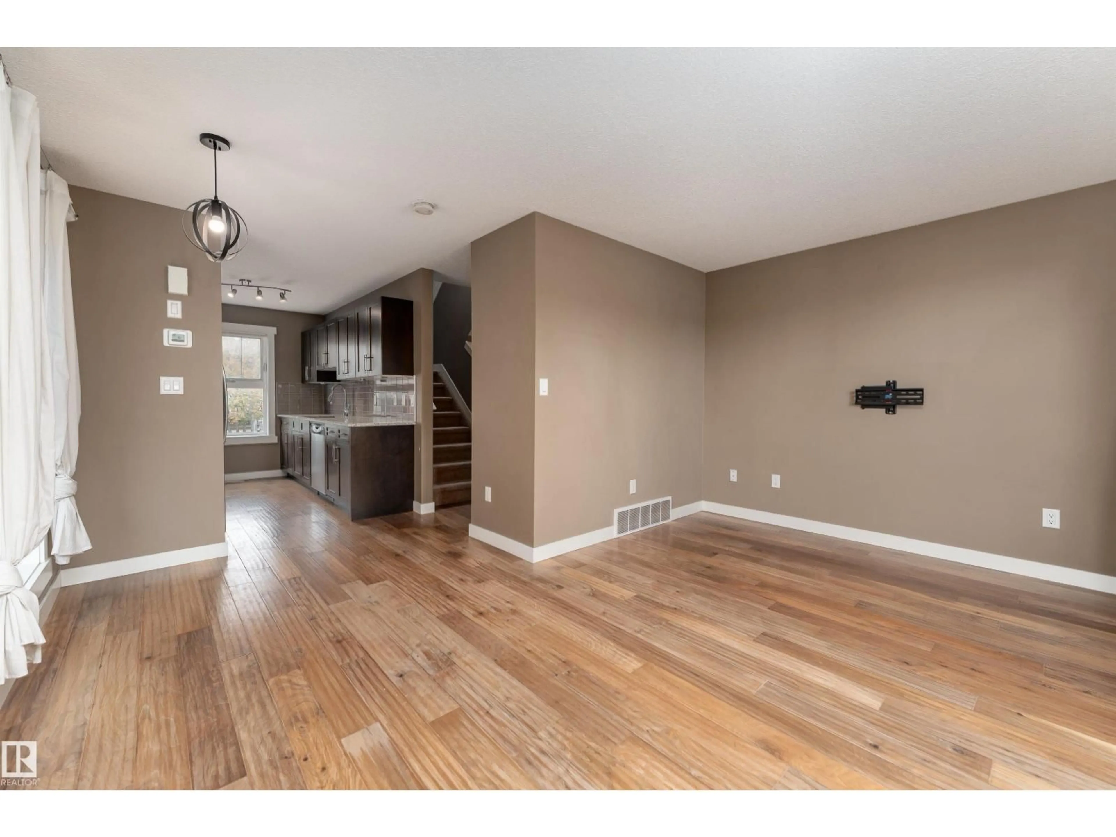 Open concept kitchen, wood/laminate floor for #158 - 401 SOUTHFORK DR, Leduc Alberta T9E0X1