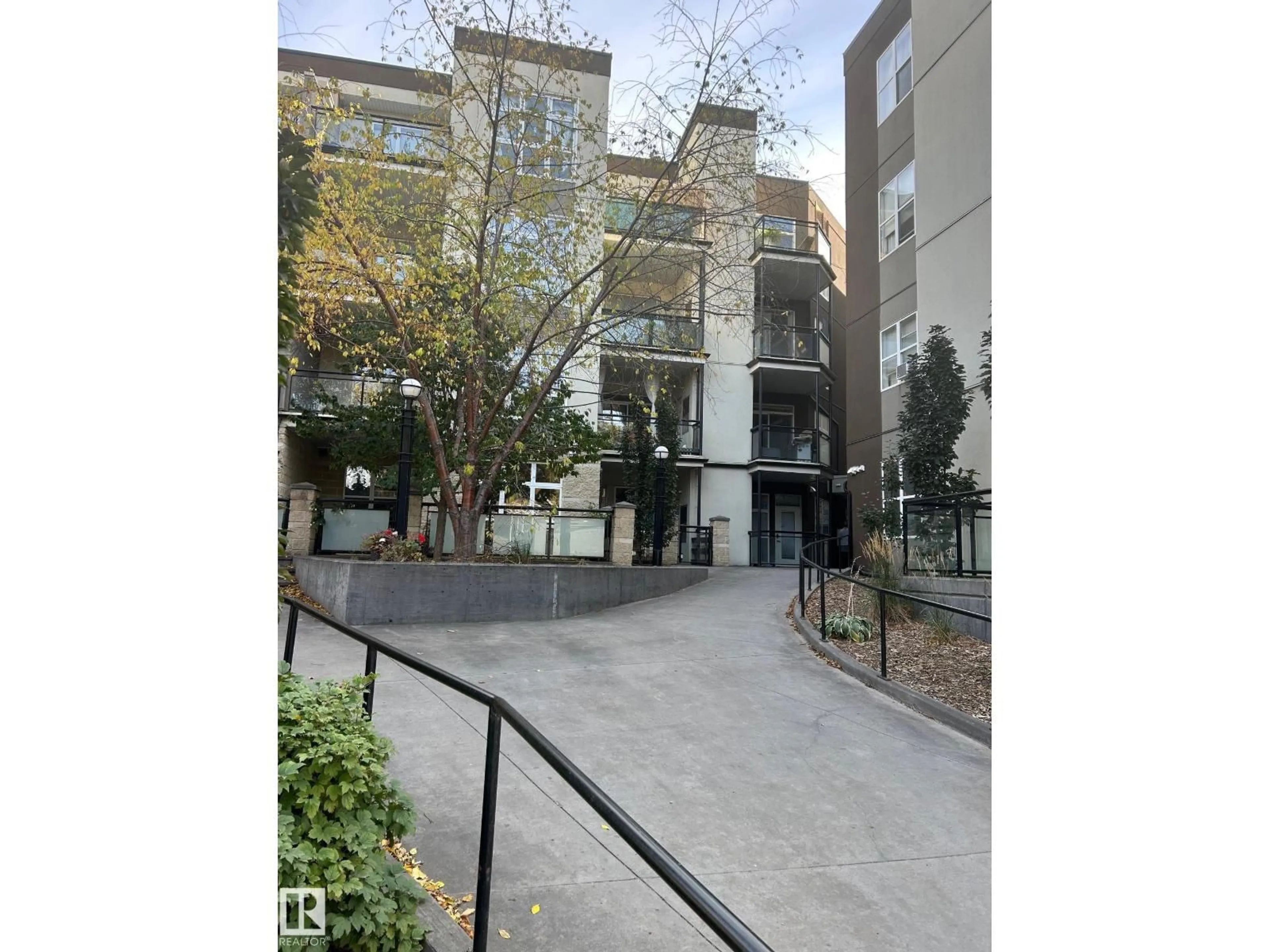A pic from outside/outdoor area/front of a property/back of a property/a pic from drone, street for #443 - 10403 122 ST, Edmonton Alberta T5N4C1