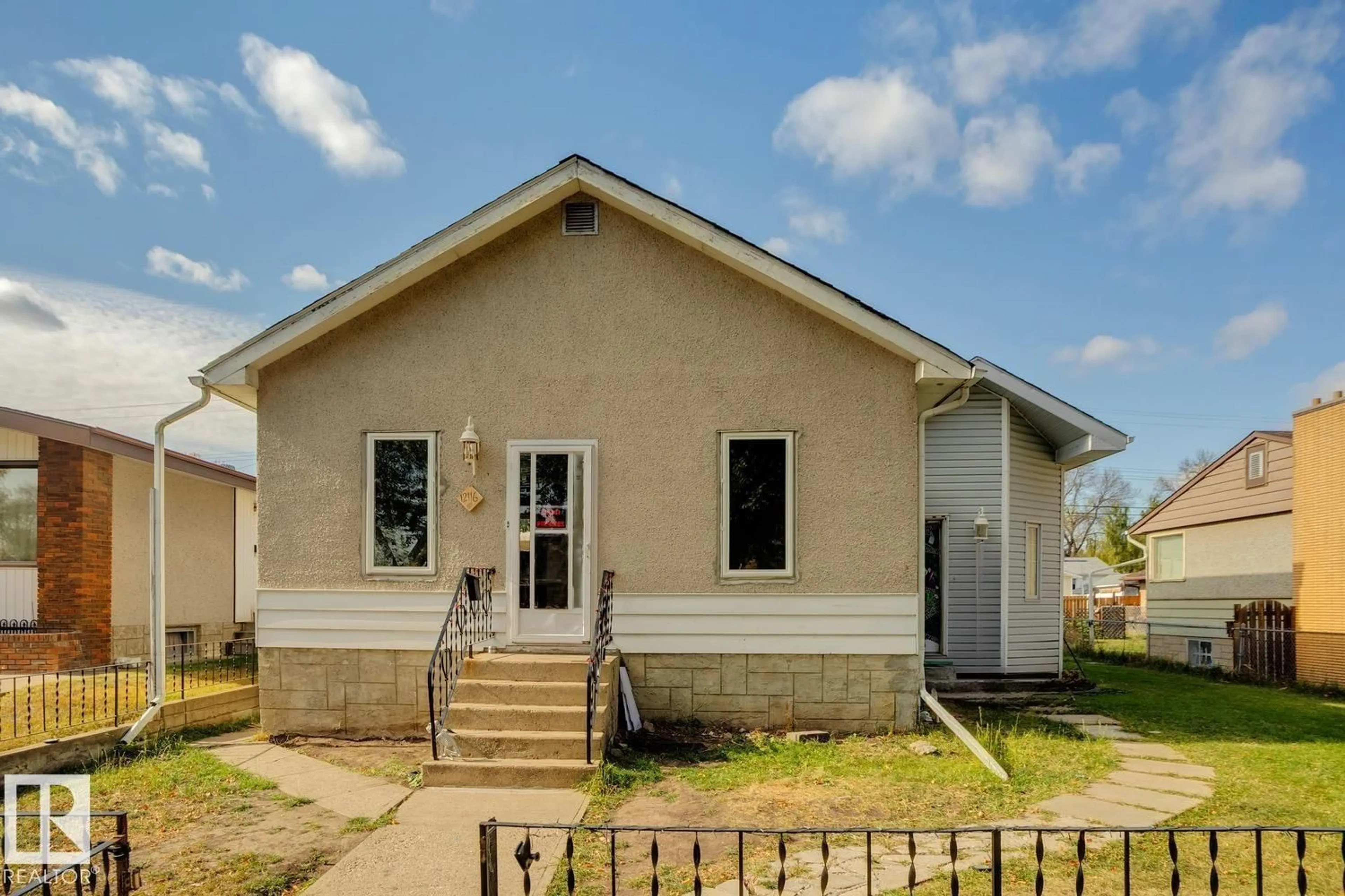 Home with vinyl exterior material, building for 12116 48 ST, Edmonton Alberta T5W2Z2
