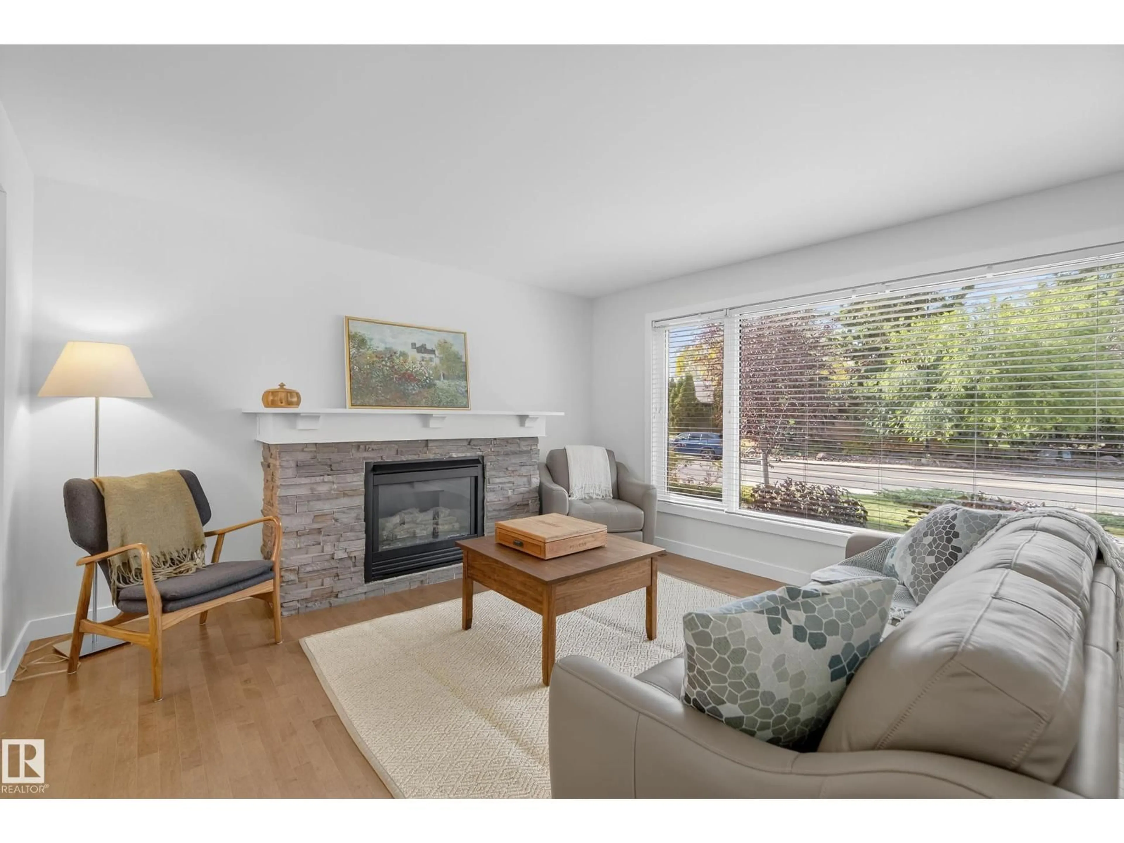 Living room with furniture, wood/laminate floor for NW - 9517 146 ST, Edmonton Alberta T5N2Y9