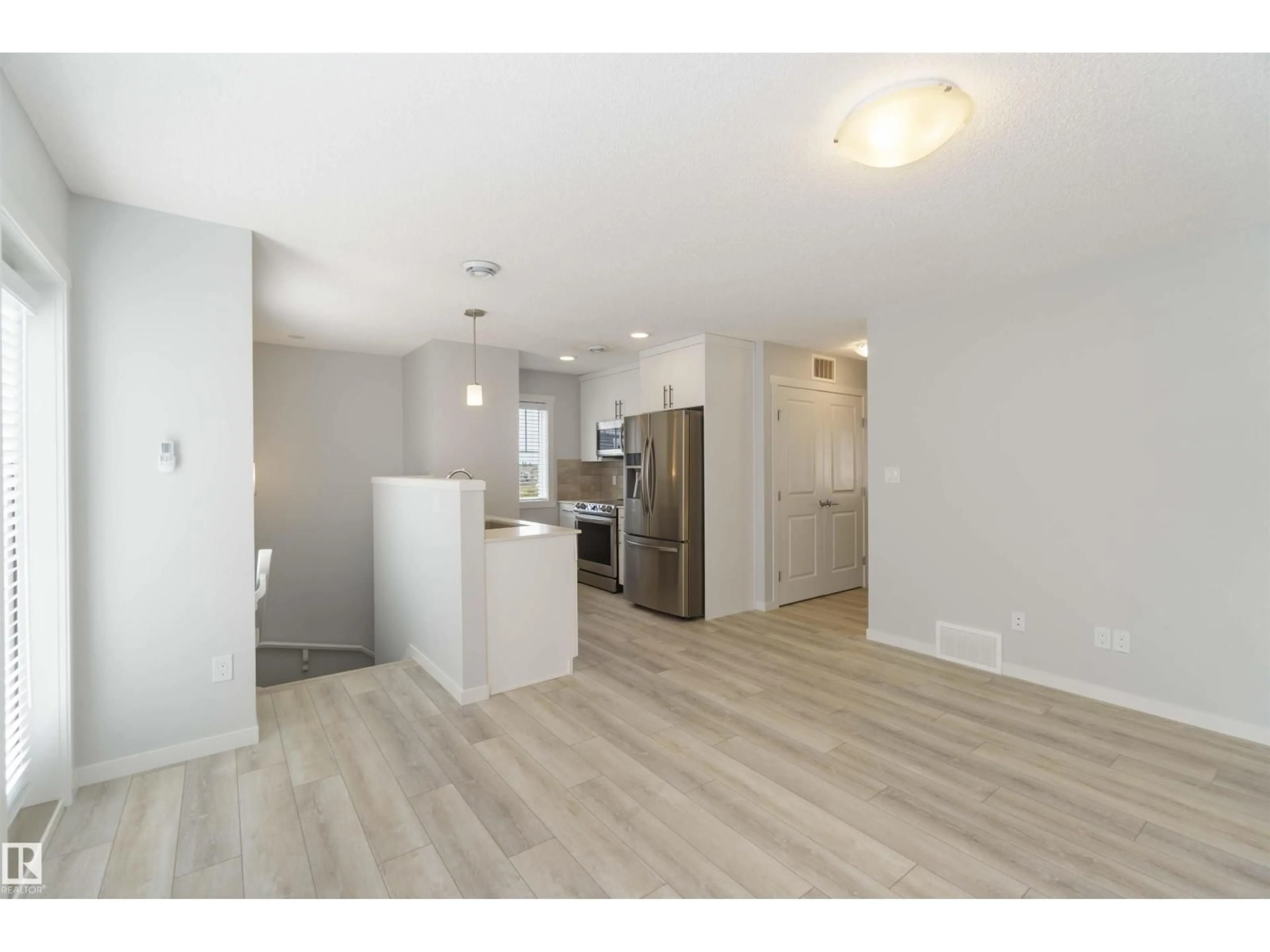 Open concept kitchen, wood/laminate floor for NW - 77 17832 78 ST, Edmonton Alberta T5Z0P7