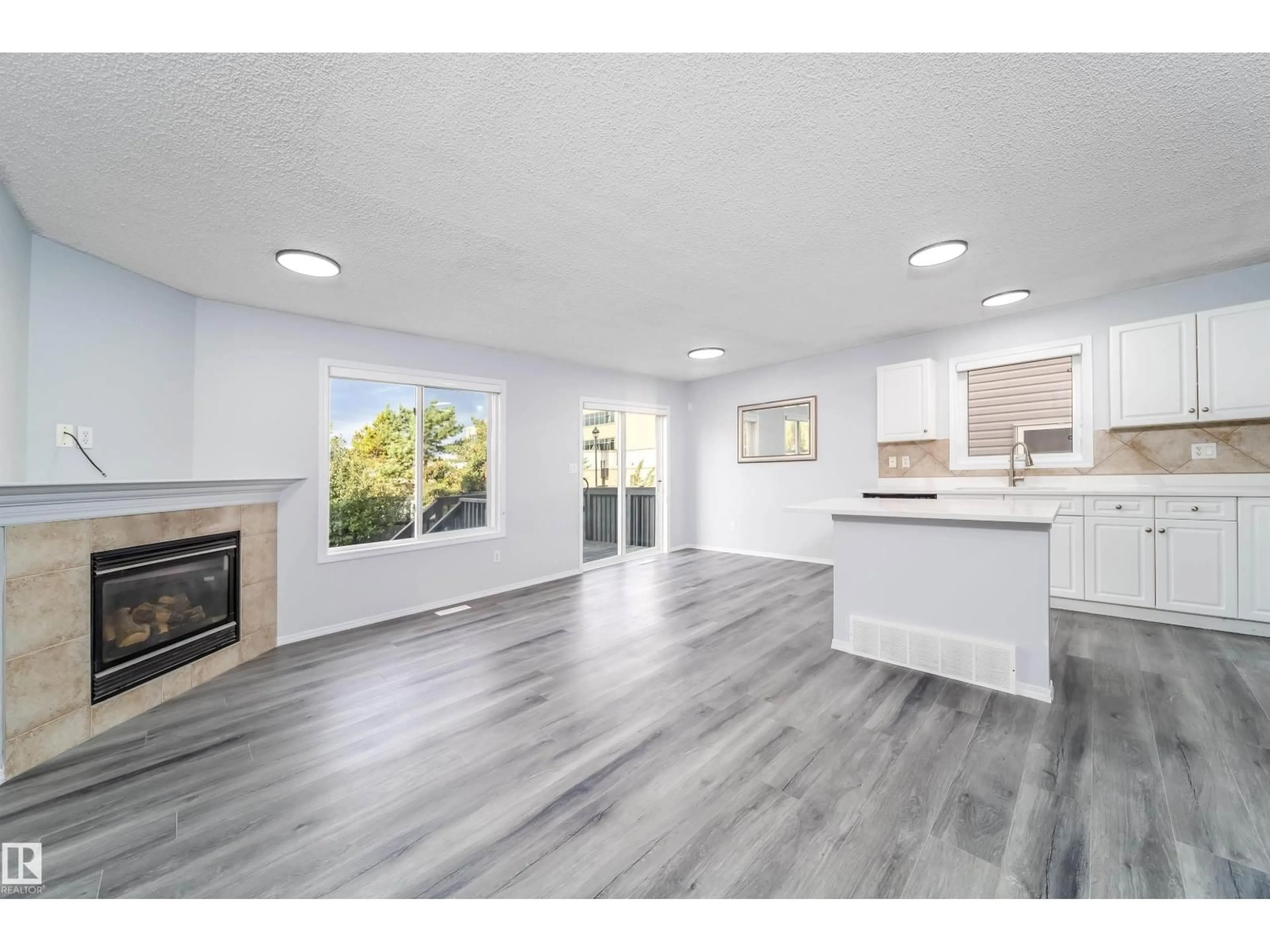 Open concept kitchen, wood/laminate floor for #32 - 120 MAGRATH RD, Edmonton Alberta T6R0C6