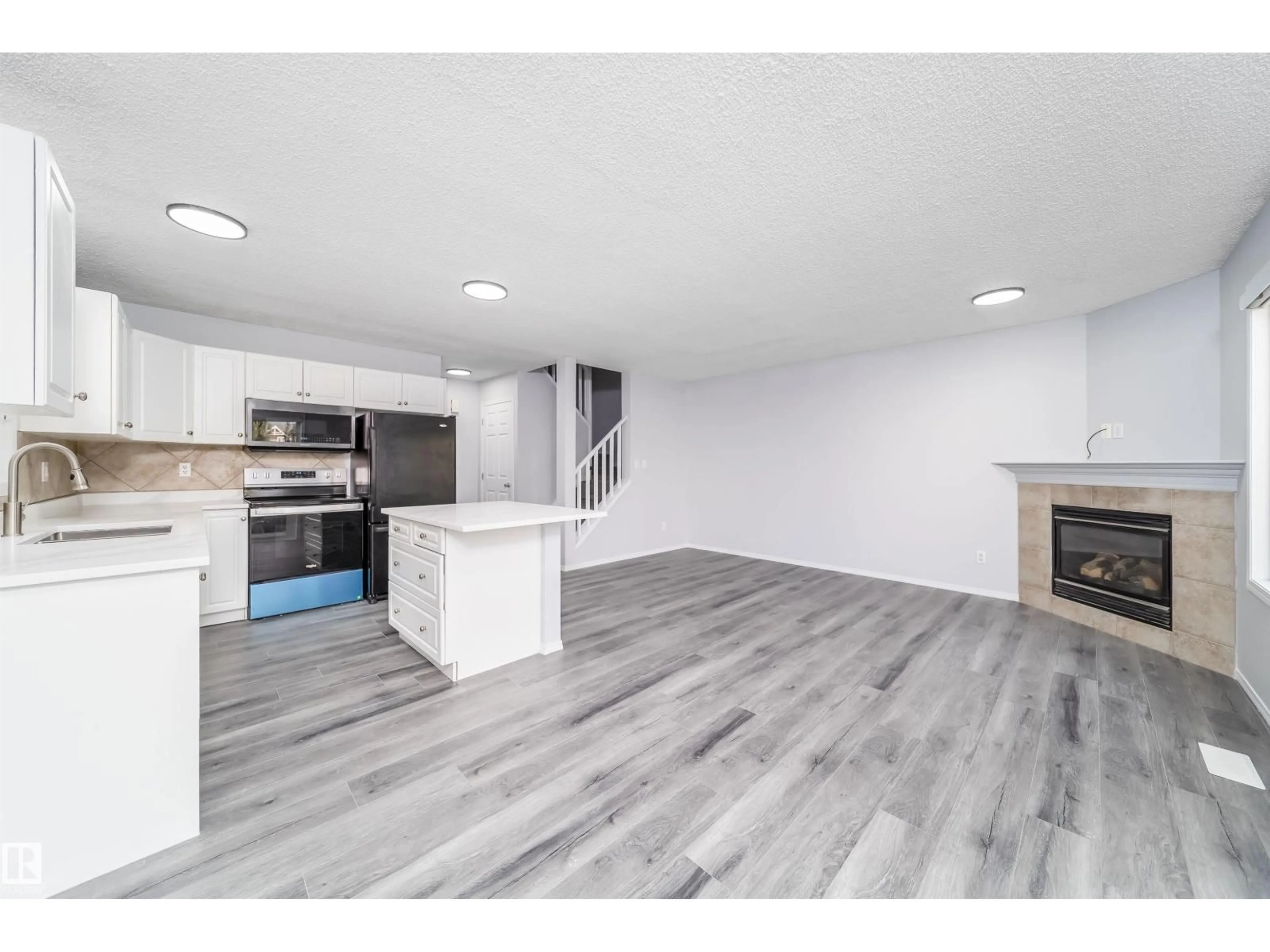 Open concept kitchen, wood/laminate floor for #32 - 120 MAGRATH RD, Edmonton Alberta T6R0C6