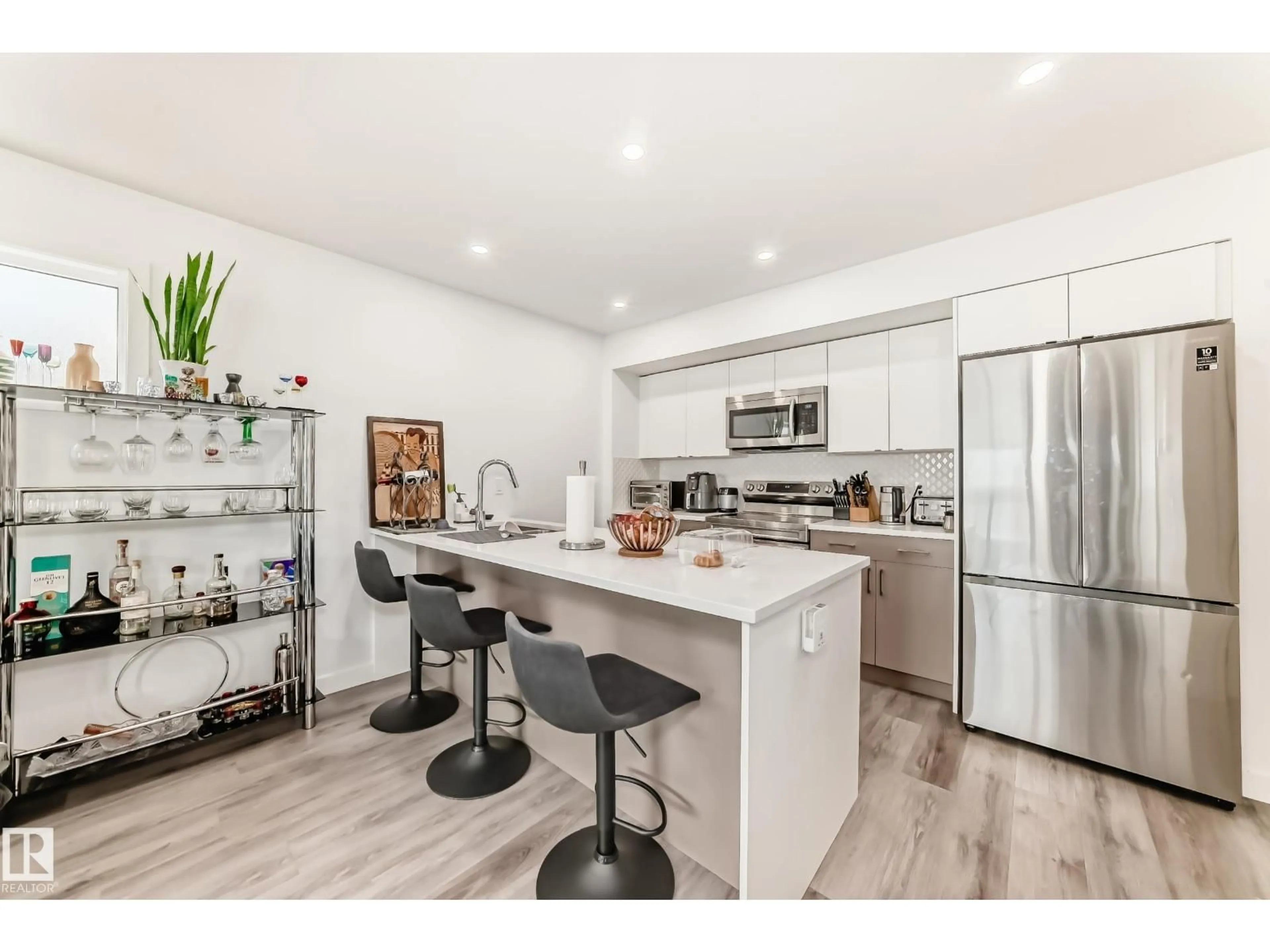 Open concept kitchen, wood/laminate floor for 11326 95A ST ST, Edmonton Alberta T5G1P1