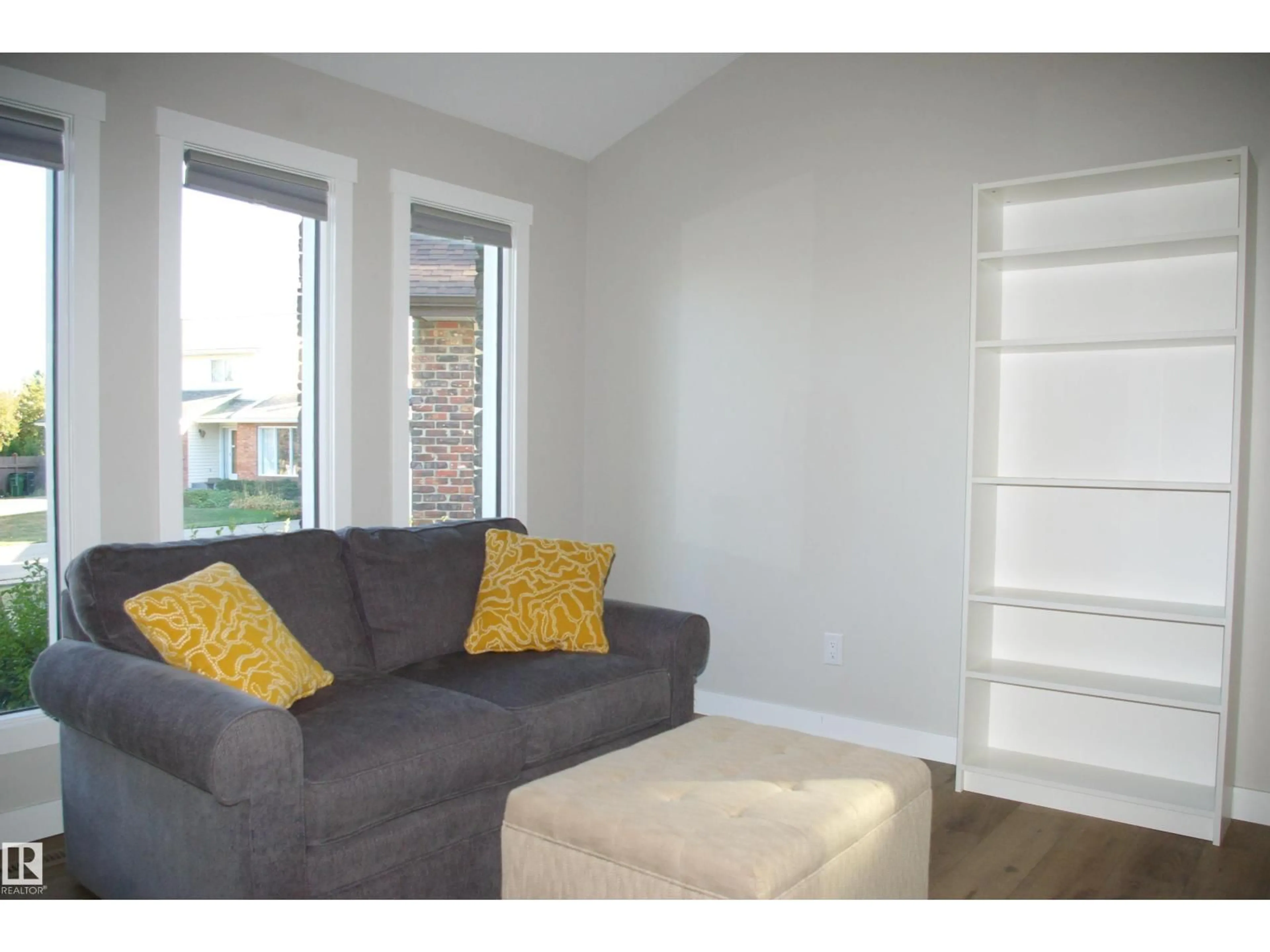 Living room with furniture, wood/laminate floor for 5822 181 ST, Edmonton Alberta T6M1V6