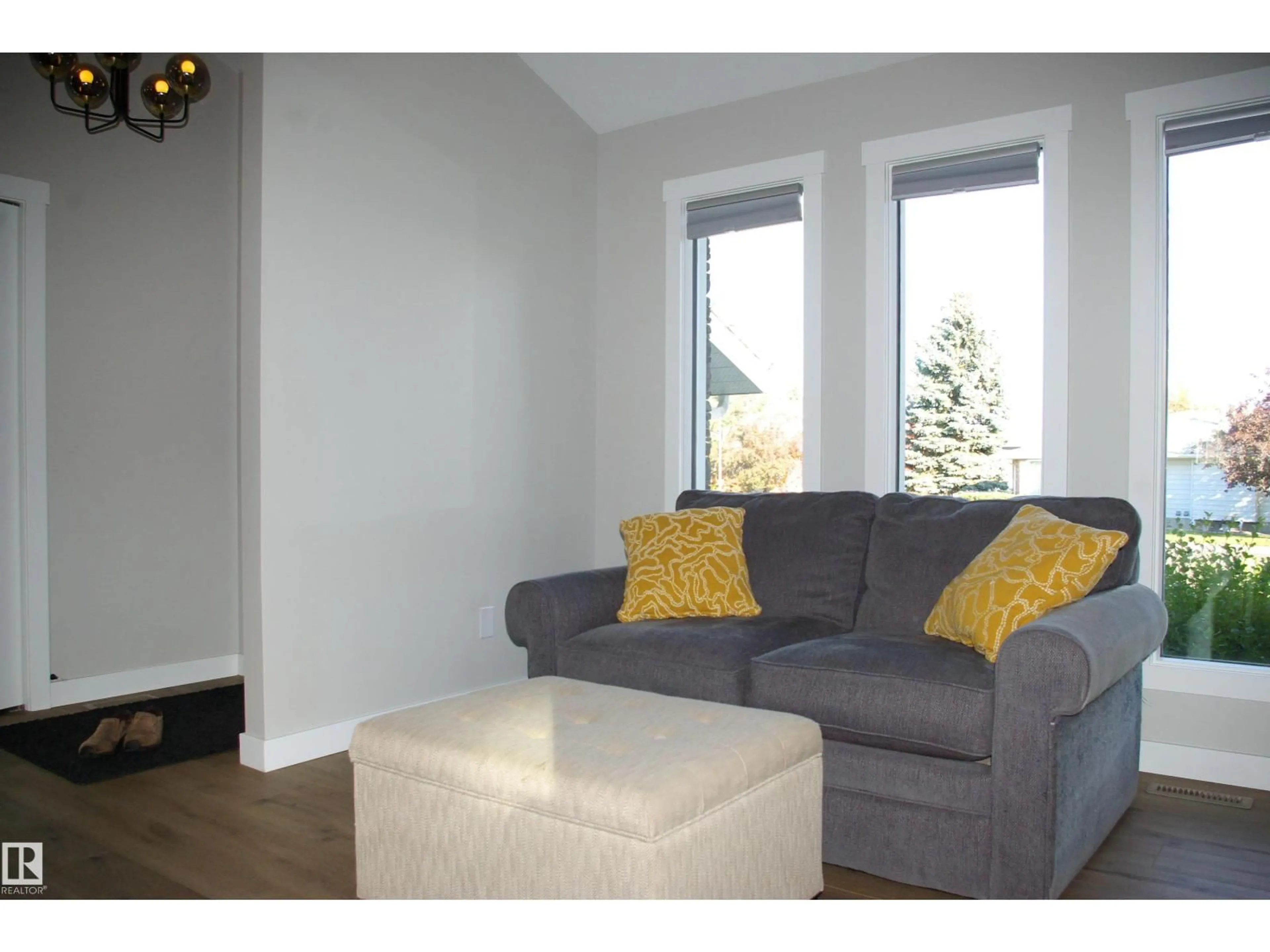 Living room with furniture, wood/laminate floor for 5822 181 ST, Edmonton Alberta T6M1V6