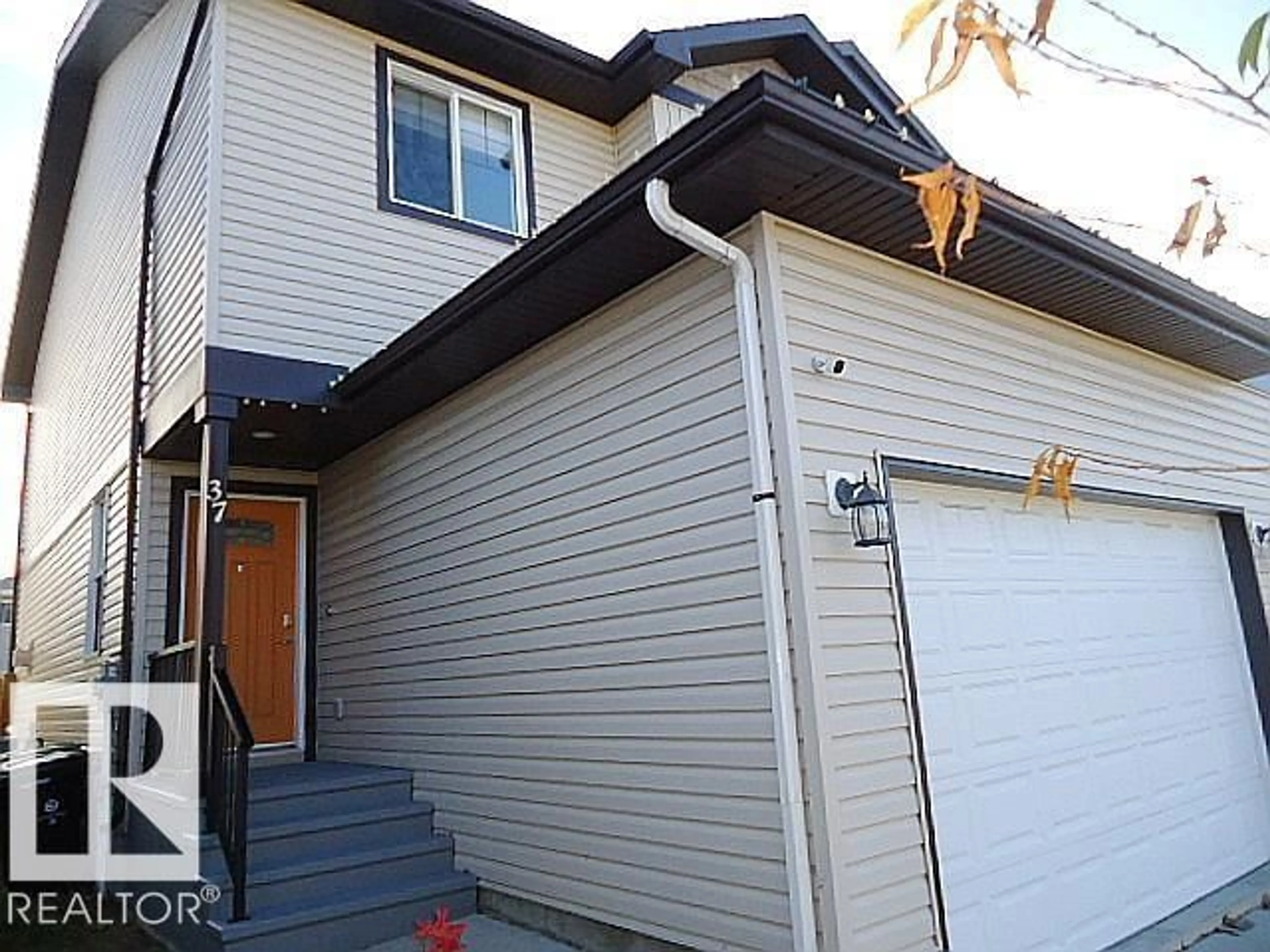 Home with vinyl exterior material, street for 37 ROSEBERRY LN, Fort Saskatchewan Alberta T8L0M6