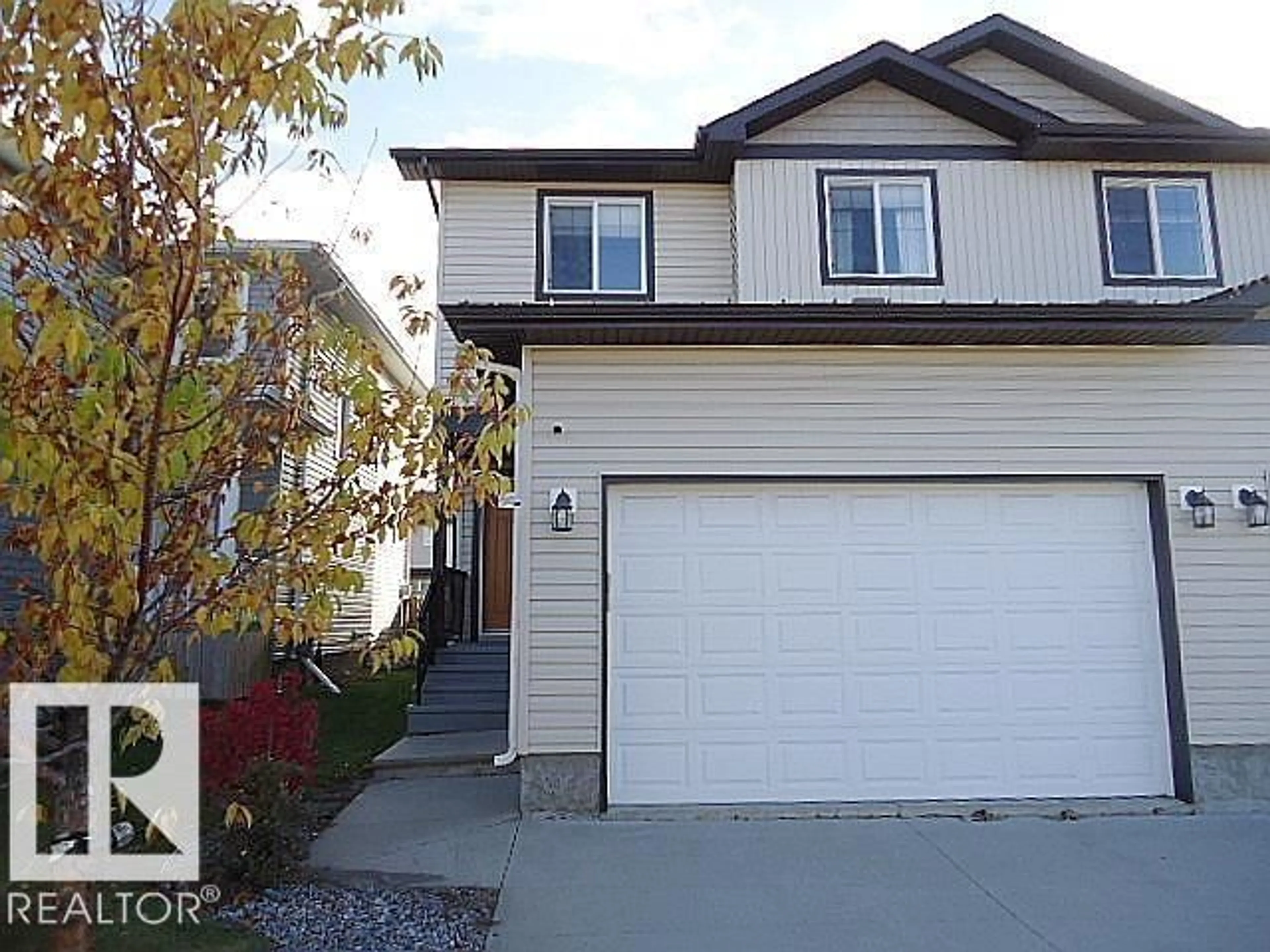 Home with vinyl exterior material, street for 37 ROSEBERRY LN, Fort Saskatchewan Alberta T8L0M6