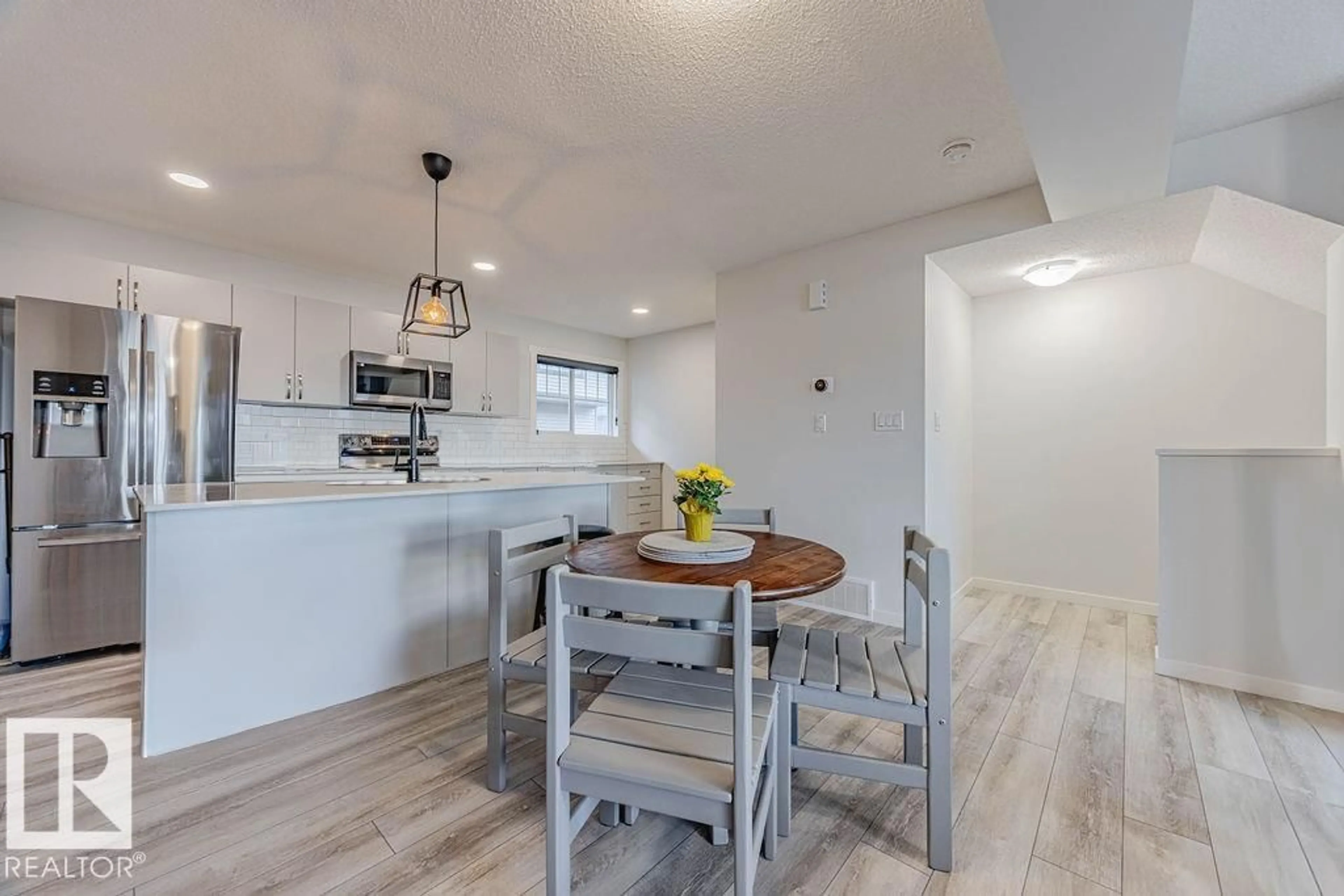 Open concept kitchen, wood/laminate floor for #63 MCLAUGHLIN DR, Spruce Grove Alberta T7X0E1