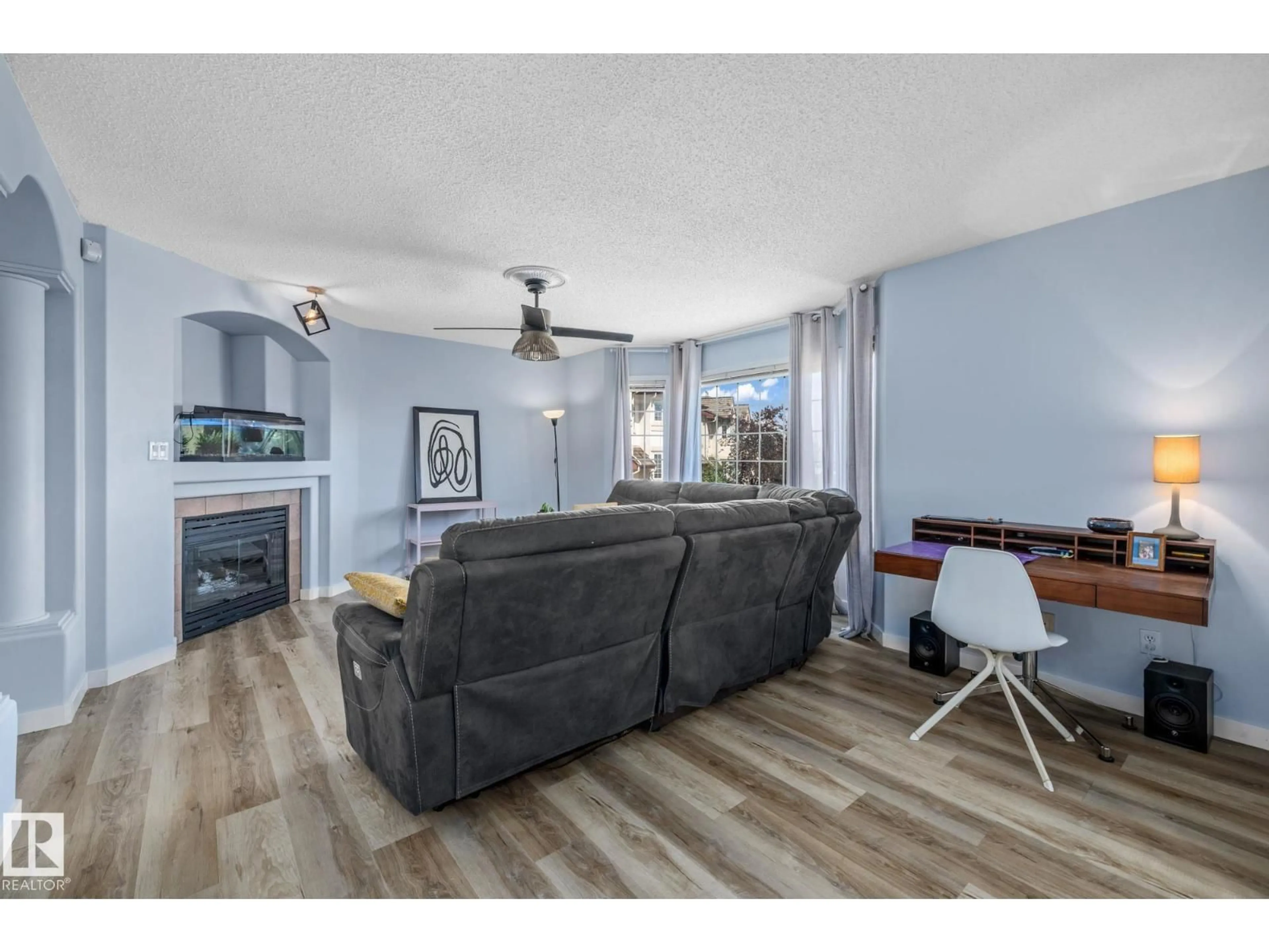 Living room with furniture, wood/laminate floor for #23 - 1237 CARTER CREST RD, Edmonton Alberta T6R2R2