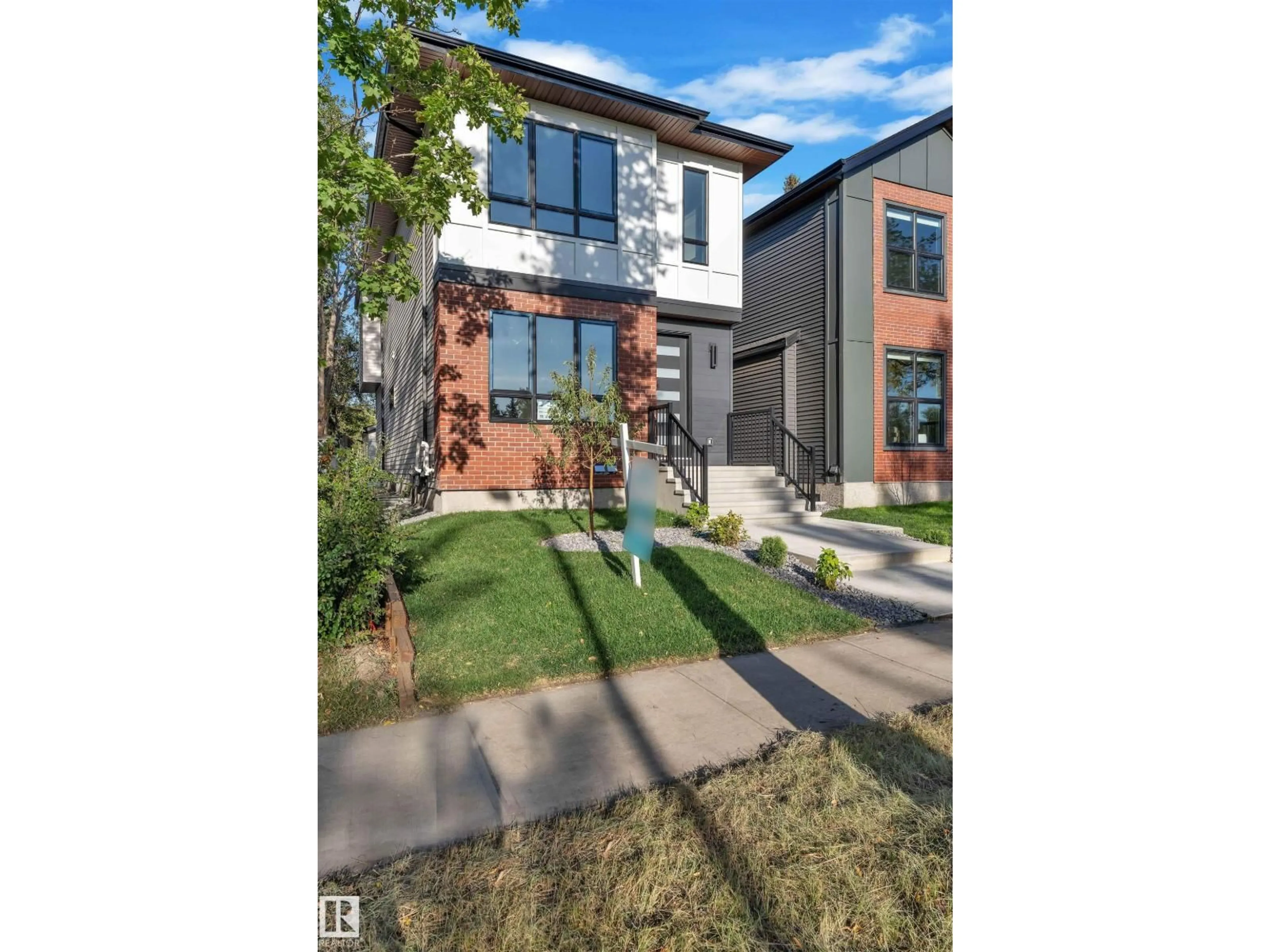 Home with brick exterior material, street for NW - 10725 132 ST, Edmonton Alberta T5M1C8