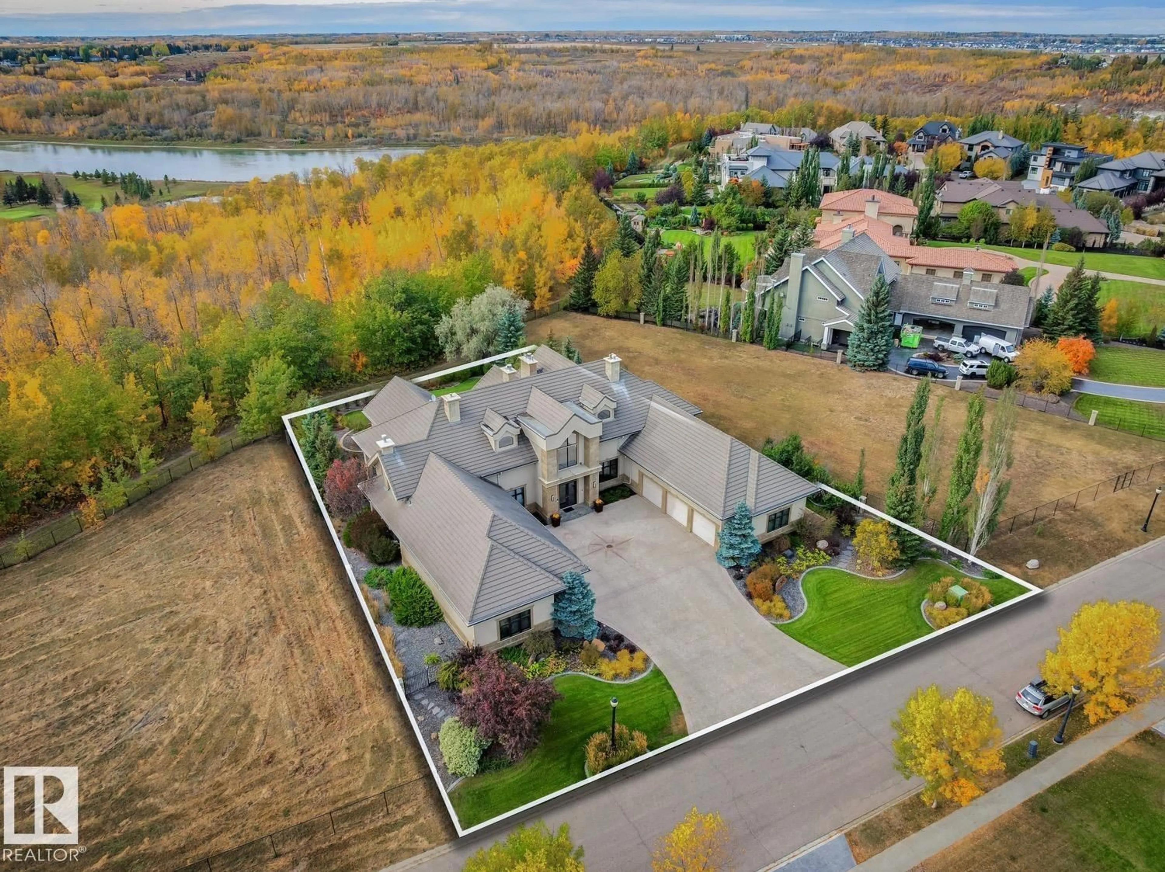A pic from outside/outdoor area/front of a property/back of a property/a pic from drone, water/lake/river/ocean view for 56 WINDERMERE DR, Edmonton Alberta T6X0S1