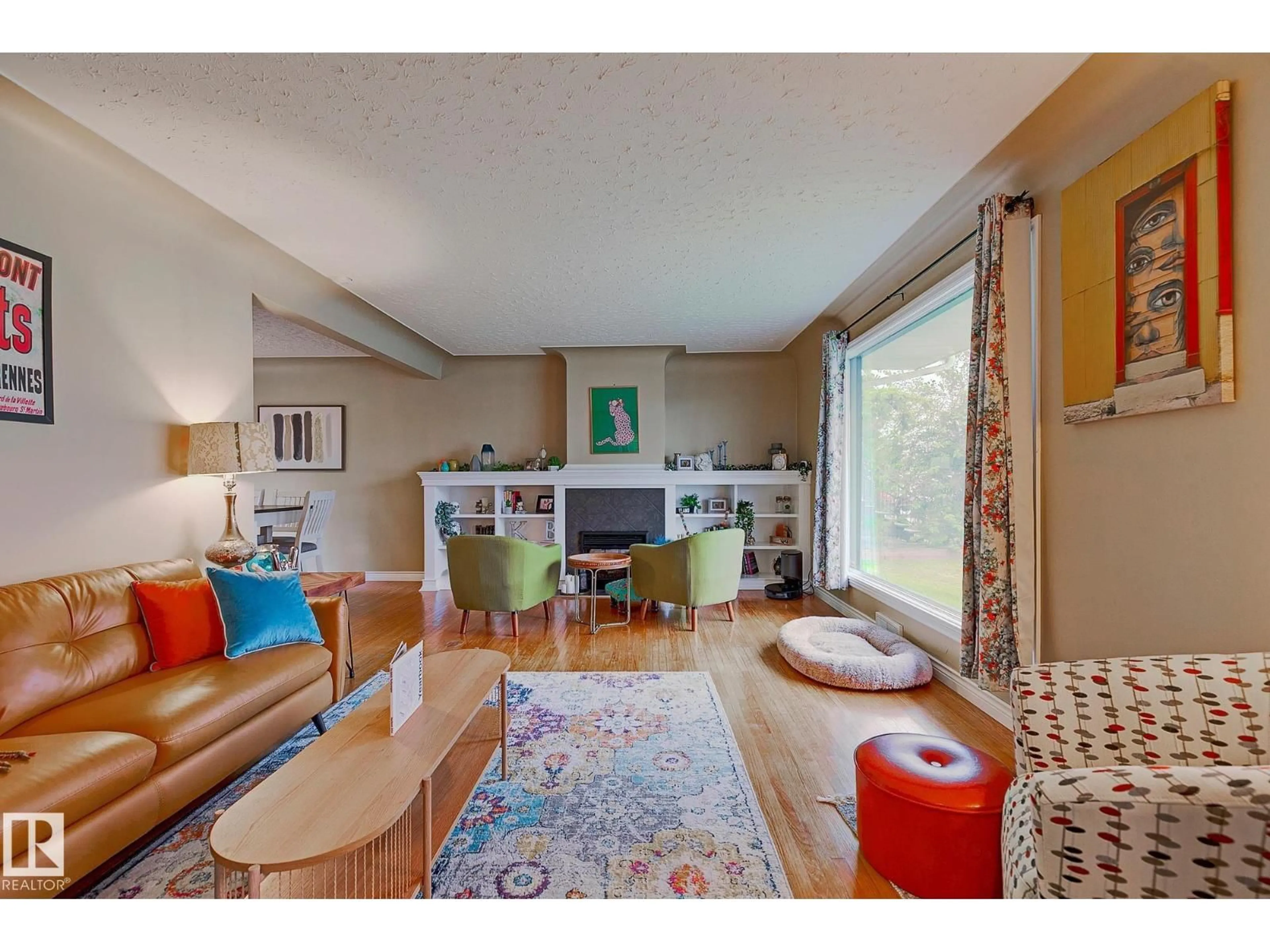 Living room with furniture, wood/laminate floor for 13919 102 AV, Edmonton Alberta T5N0P5