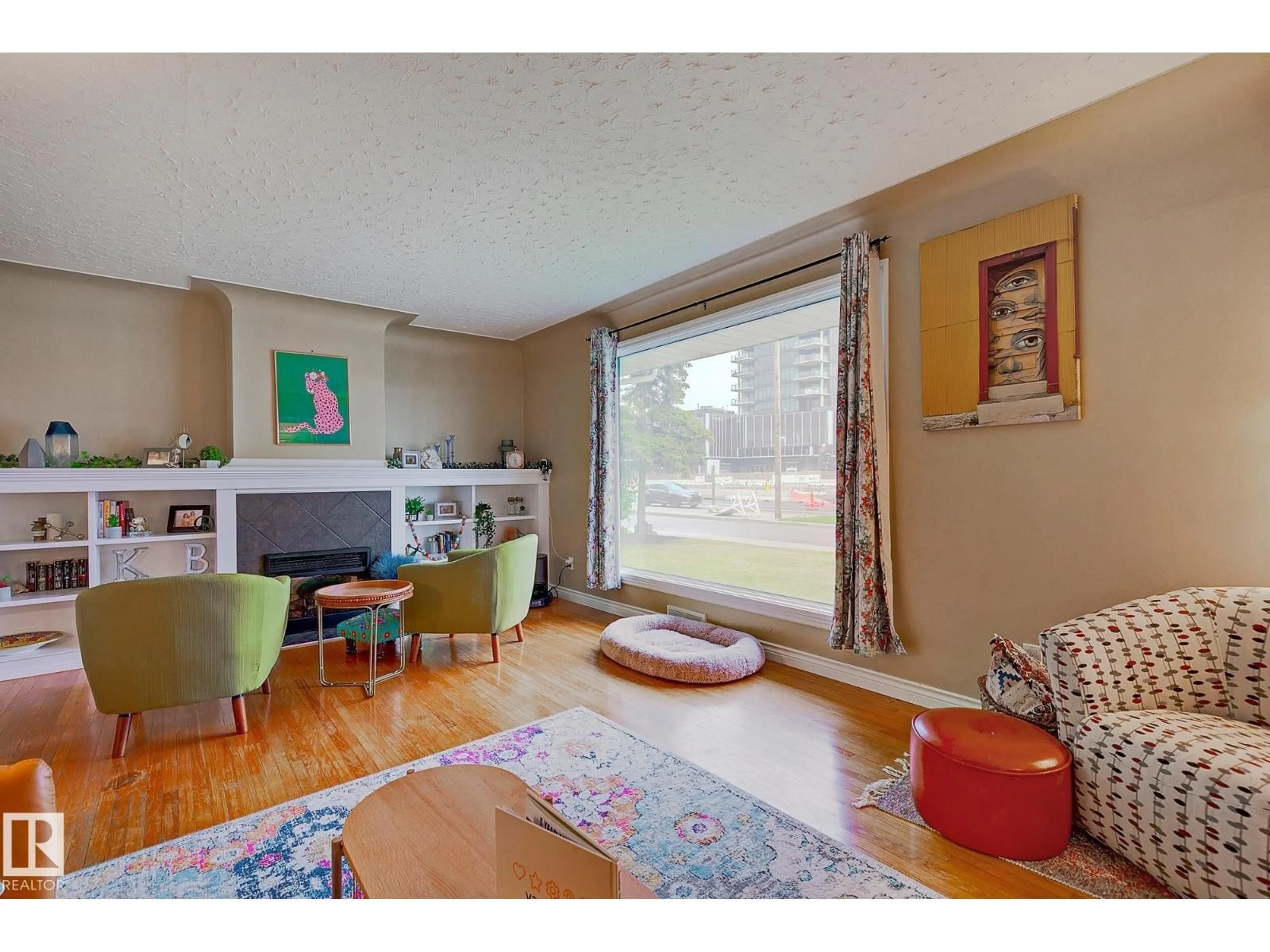 Living room with furniture, wood/laminate floor for 13919 102 AV, Edmonton Alberta T5N0P5
