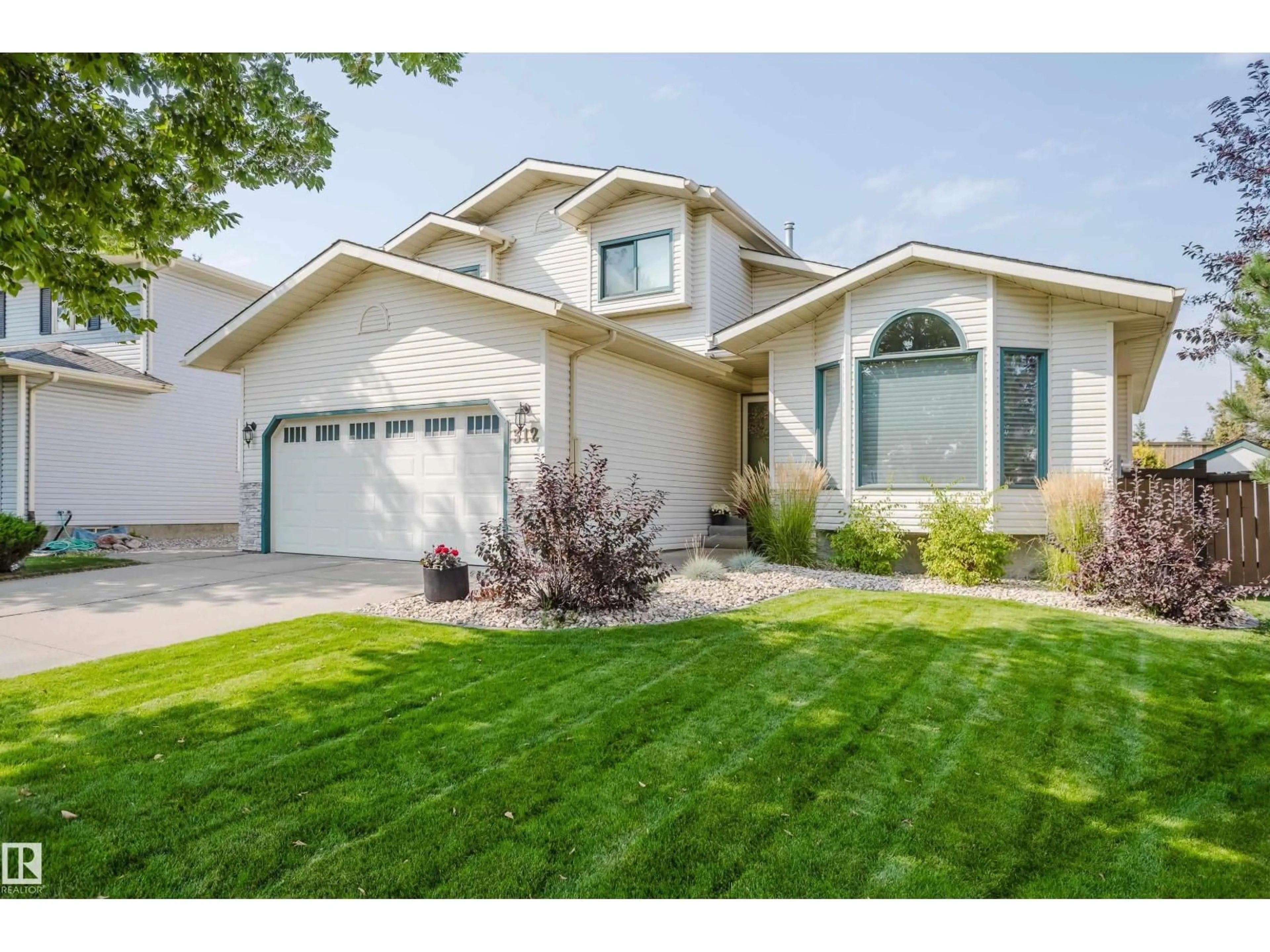 Home with vinyl exterior material, street for 312 BUCHANAN WY, Edmonton Alberta T6R2B4