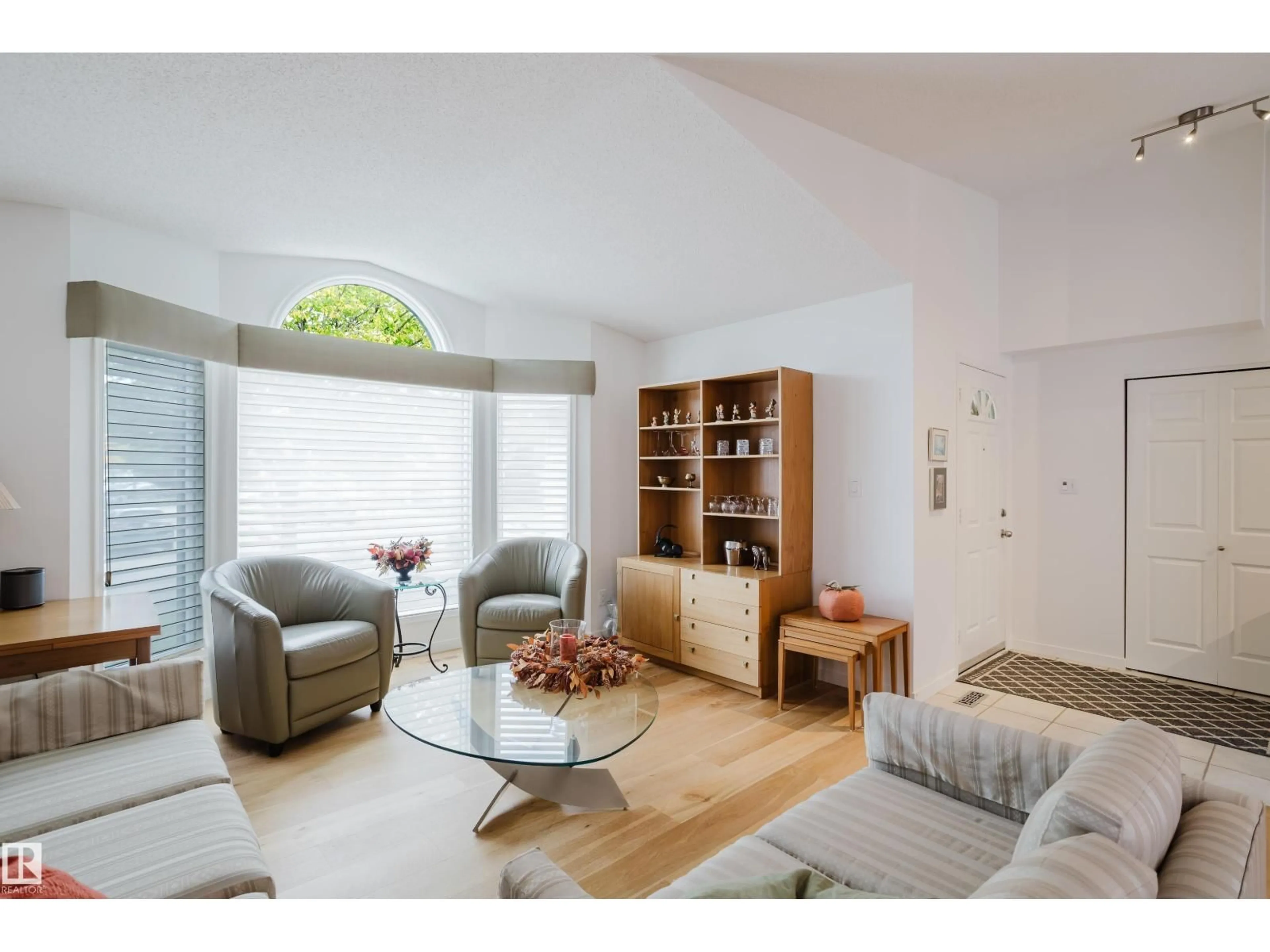 Living room with furniture, wood/laminate floor for 312 BUCHANAN WY, Edmonton Alberta T6R2B4