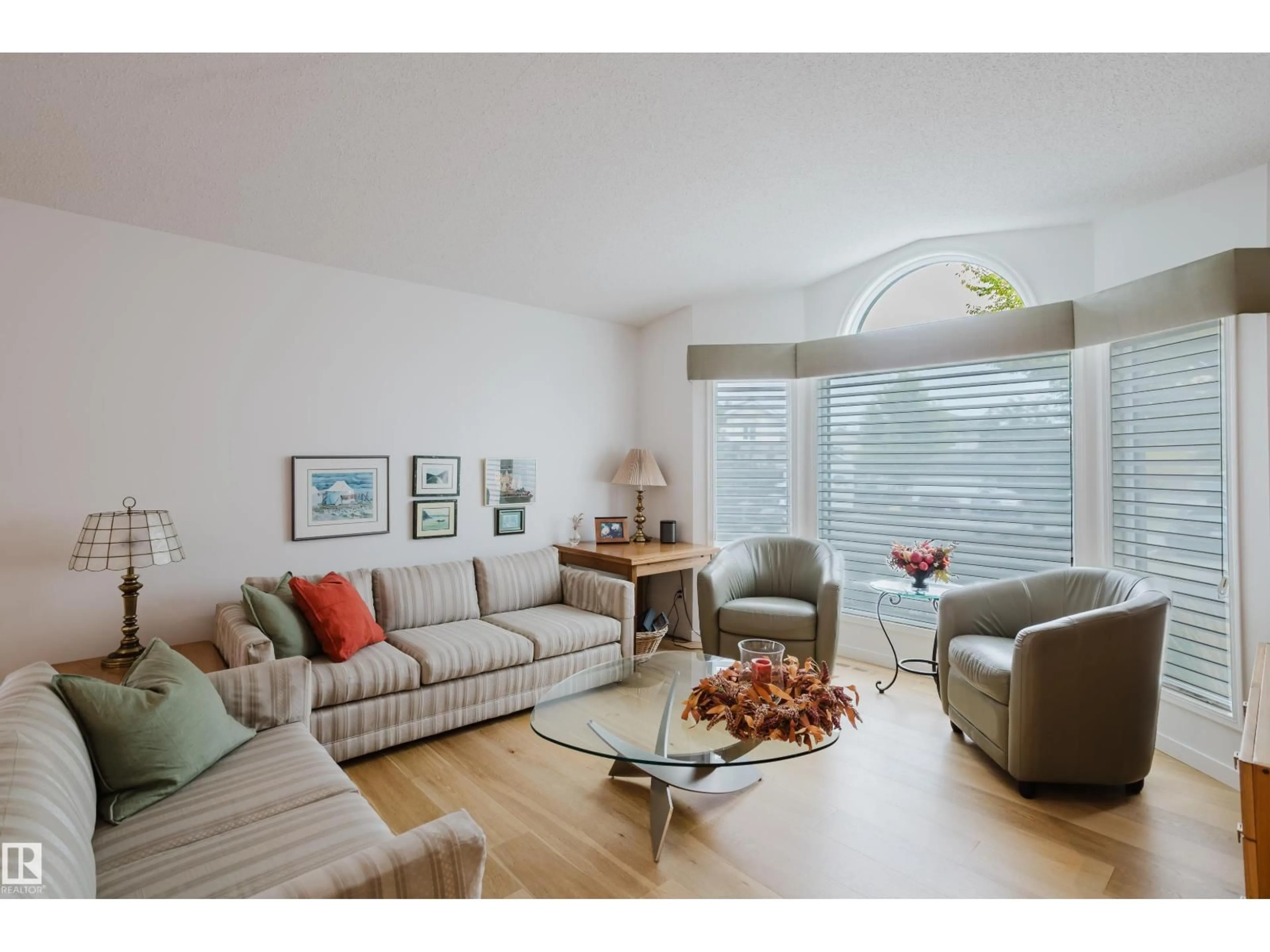 Living room with furniture, wood/laminate floor for 312 BUCHANAN WY, Edmonton Alberta T6R2B4