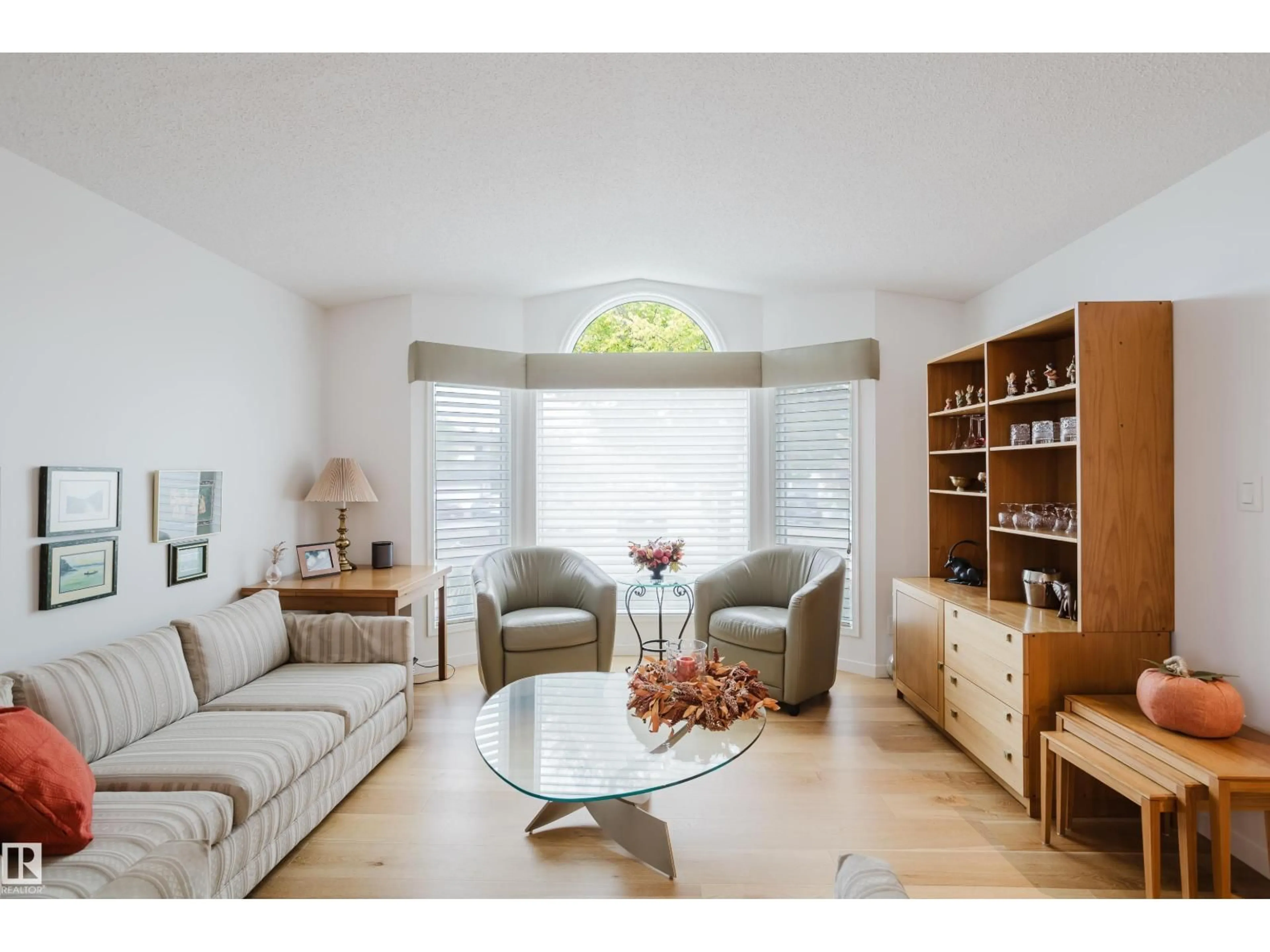 Living room with furniture, wood/laminate floor for 312 BUCHANAN WY, Edmonton Alberta T6R2B4
