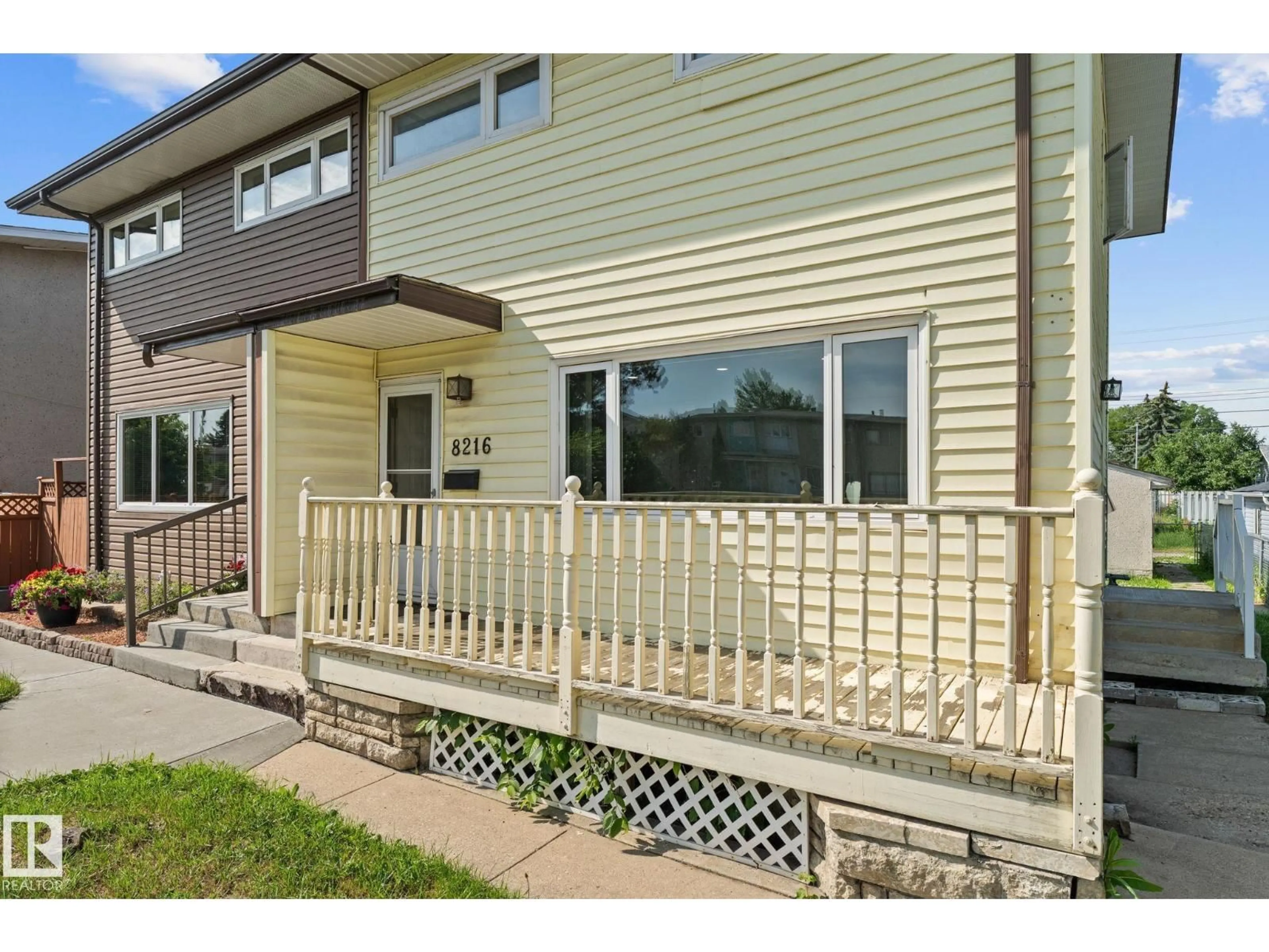 Home with vinyl exterior material, street for 8216 133A AV, Edmonton Alberta T5E1E9