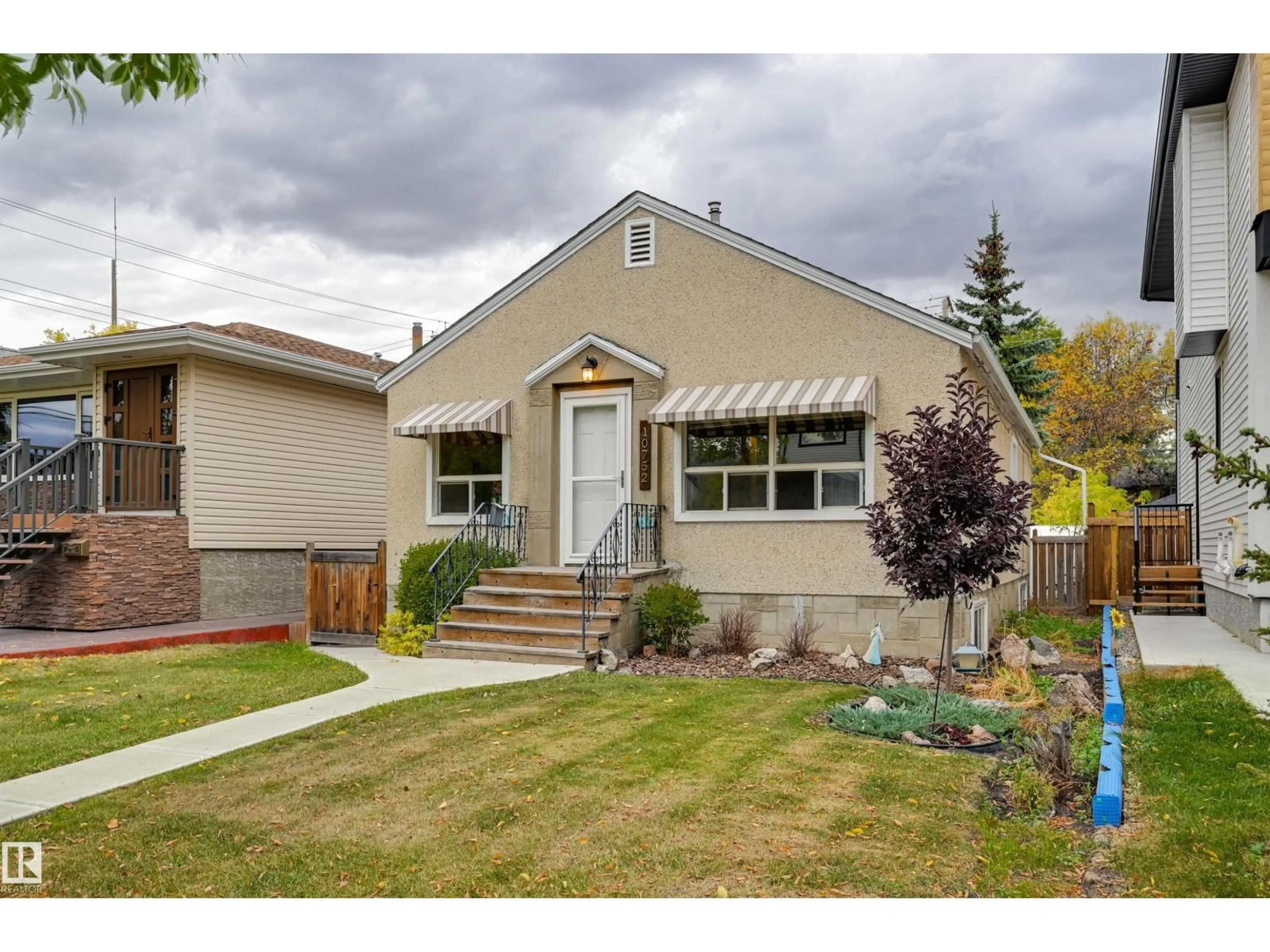 Home with vinyl exterior material, street for 10752 75 AV, Edmonton Alberta T6E1J9