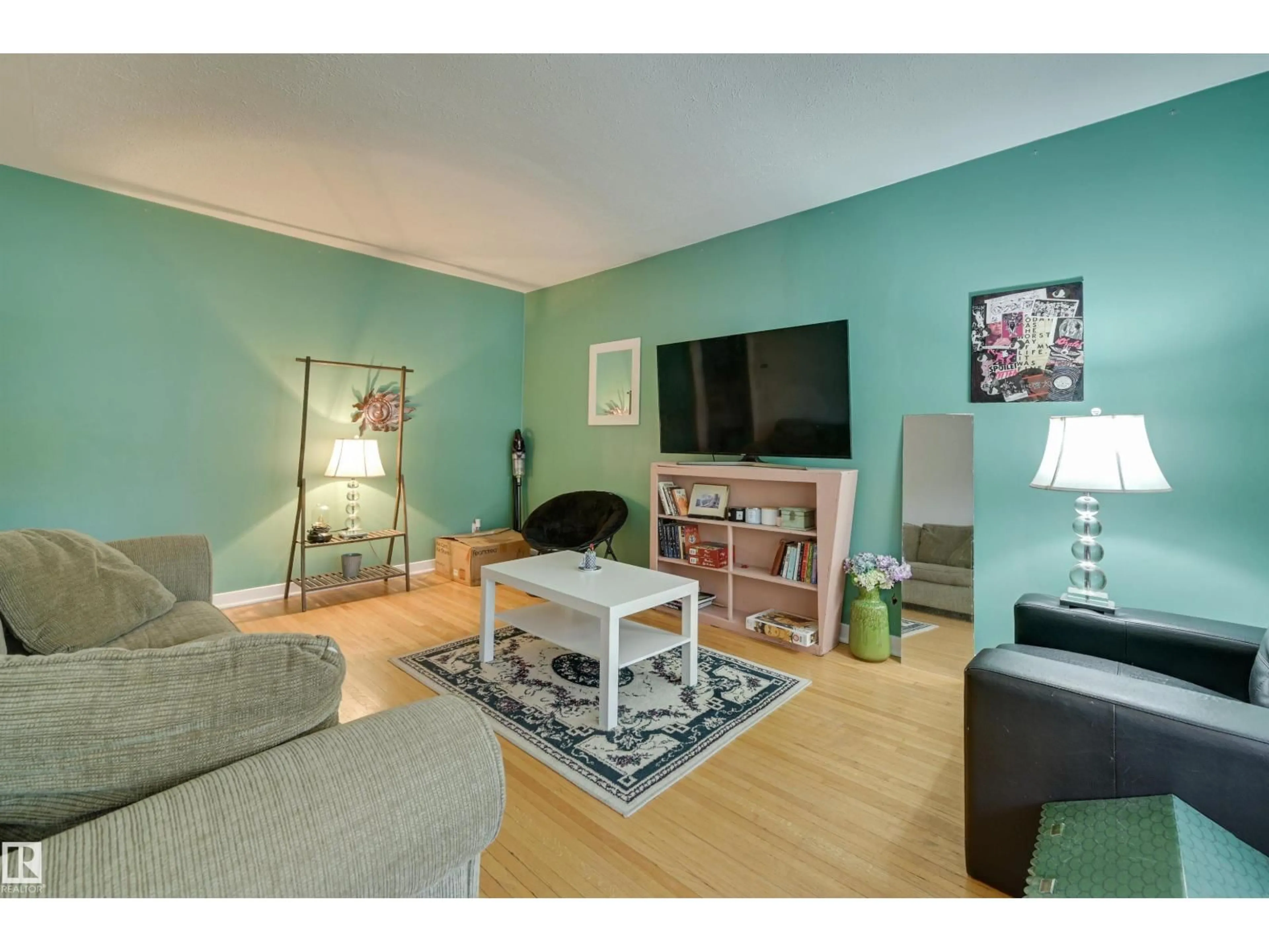 Living room with furniture, wood/laminate floor for 10752 75 AV, Edmonton Alberta T6E1J9