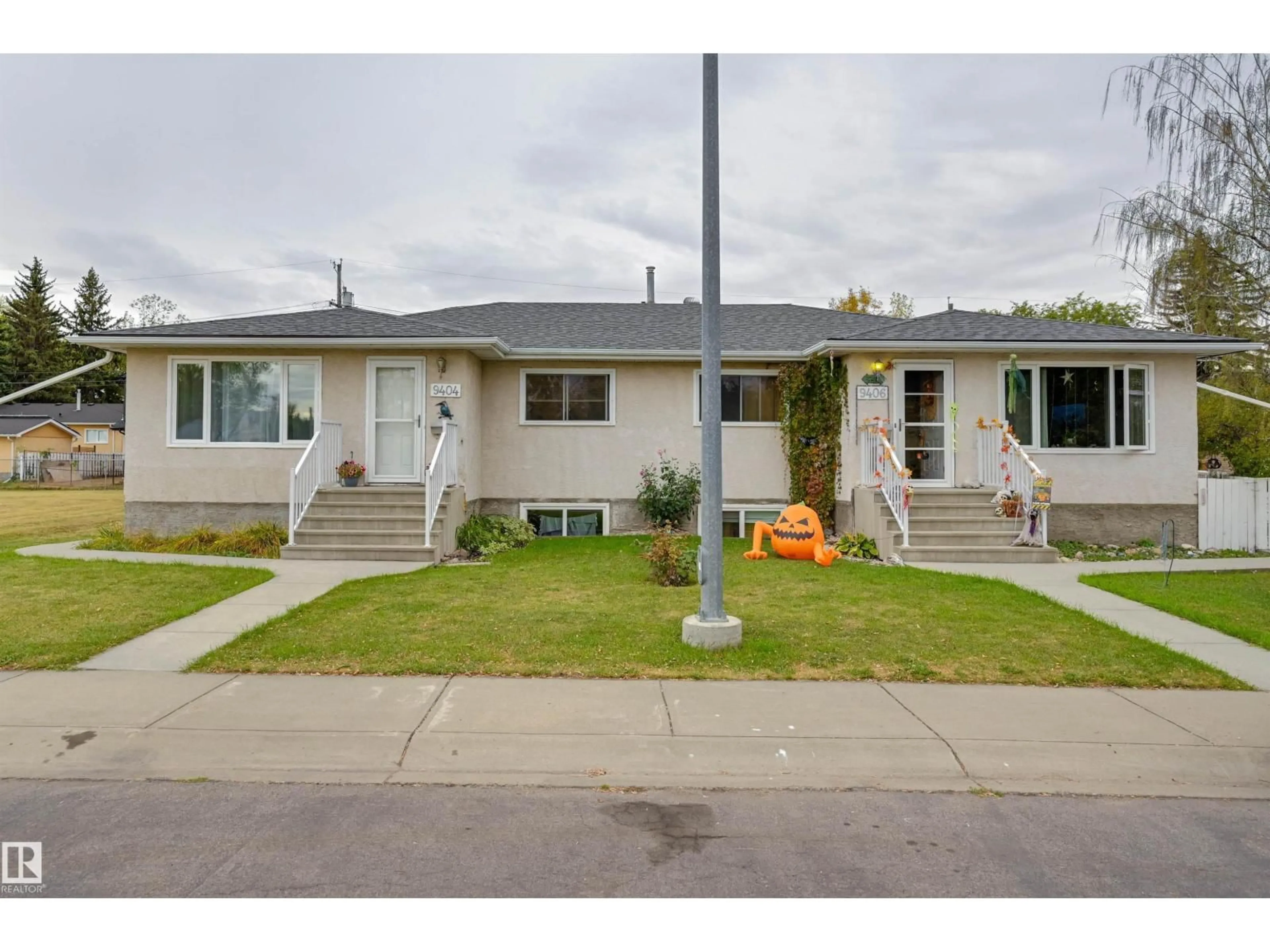 Home with vinyl exterior material, street for 9406 - 9404 HOLYROOD RD, Edmonton Alberta T6C4H4