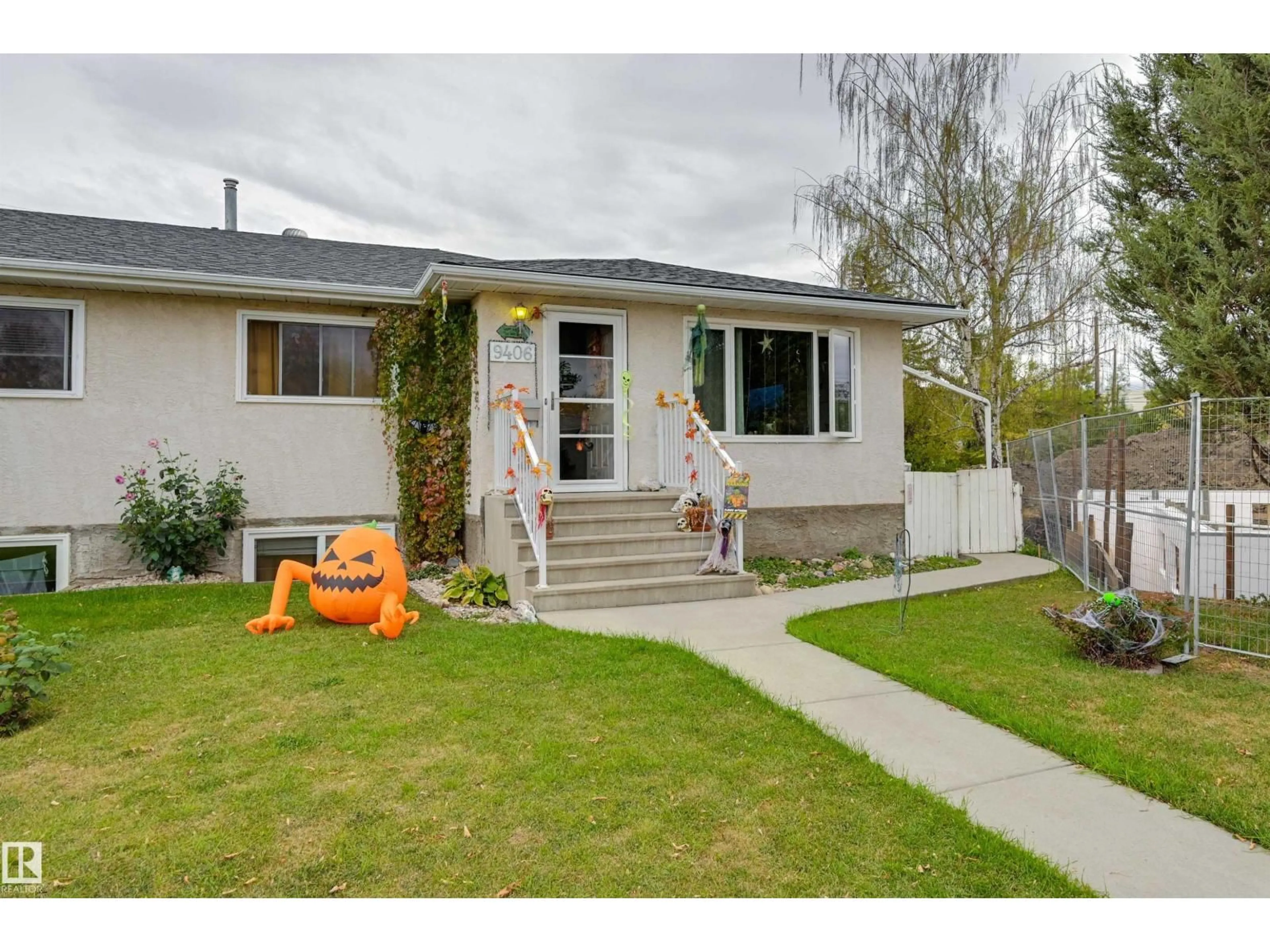 Home with vinyl exterior material, street for 9406 - 9404 HOLYROOD RD, Edmonton Alberta T6C4H4