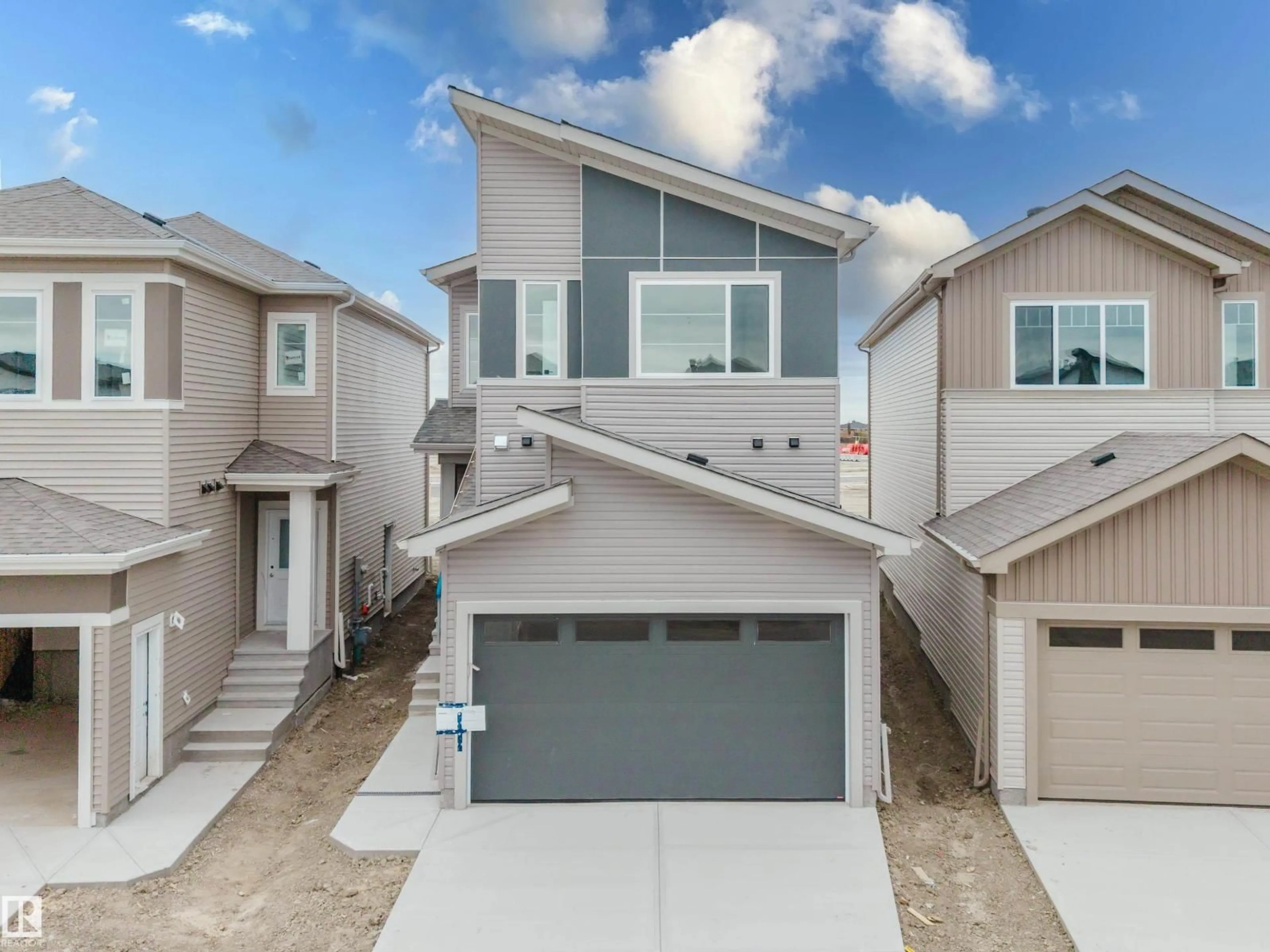 Home with vinyl exterior material, street for 341 MUNN WY, Leduc Alberta T9E0S9