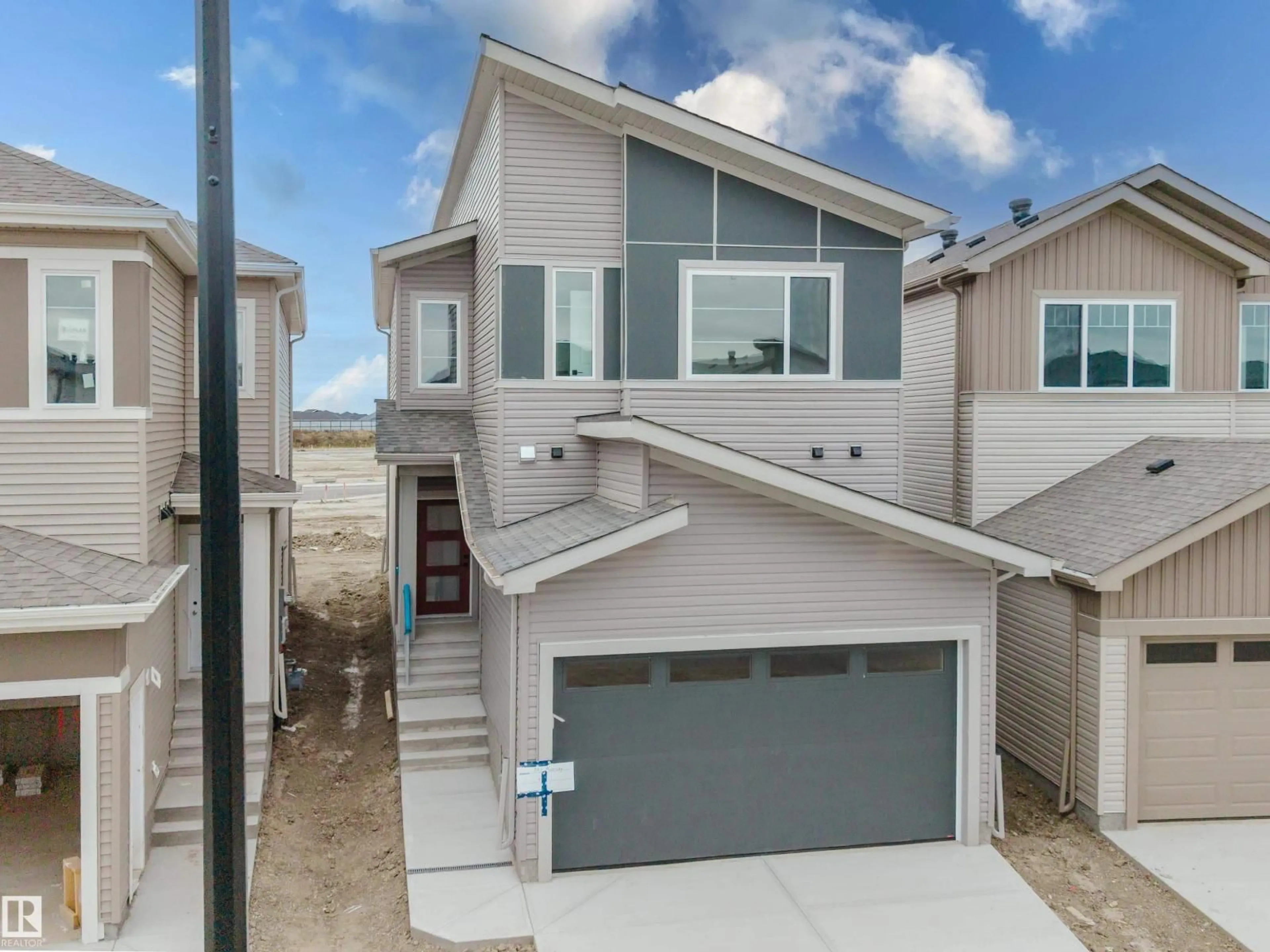 Home with vinyl exterior material, street for 341 MUNN WY, Leduc Alberta T9E0S9