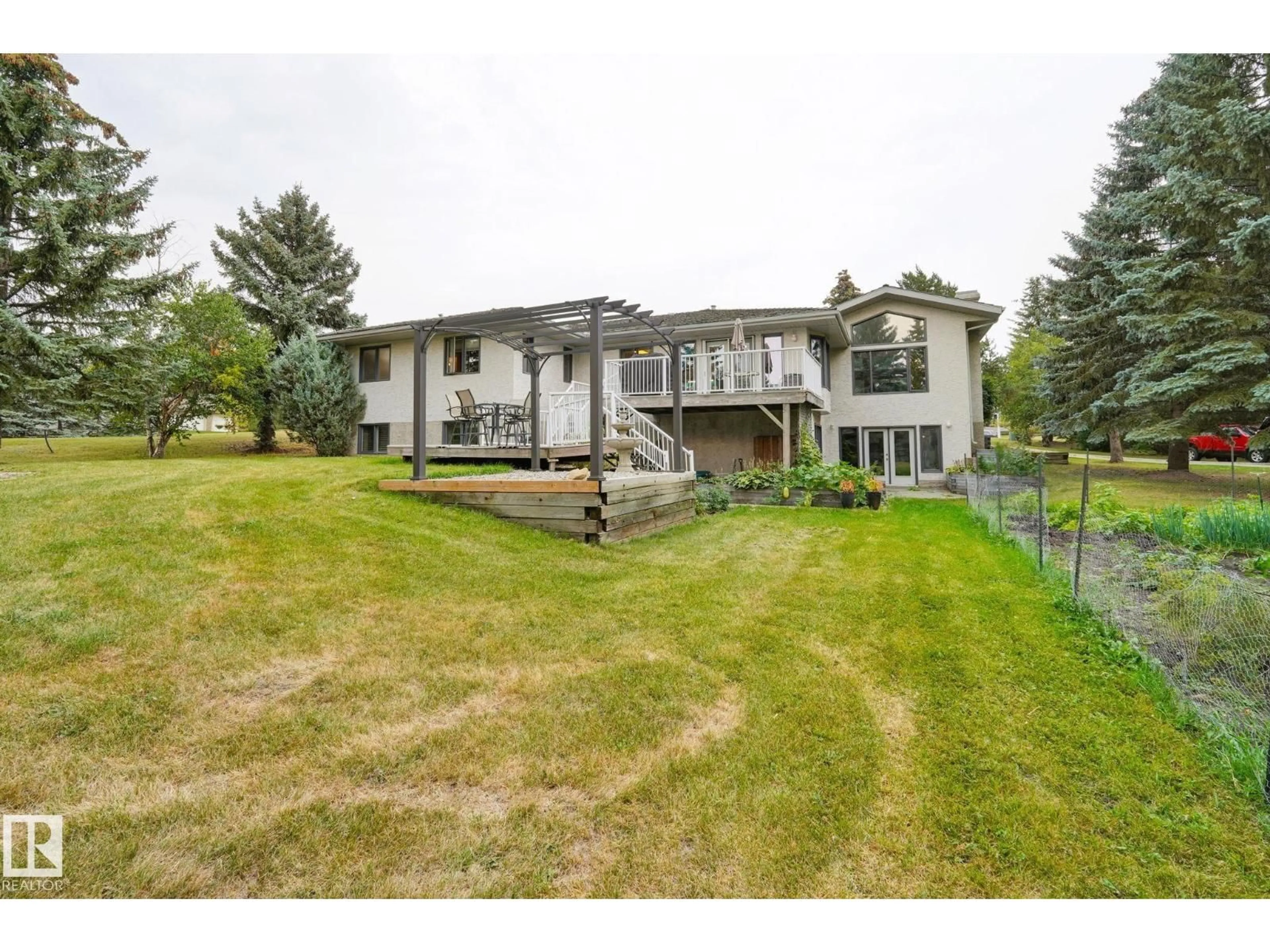 A pic from outside/outdoor area/front of a property/back of a property/a pic from drone, unknown for 79 25112 TWP ROAD 542A, Rural Sturgeon County Alberta T8T0B2