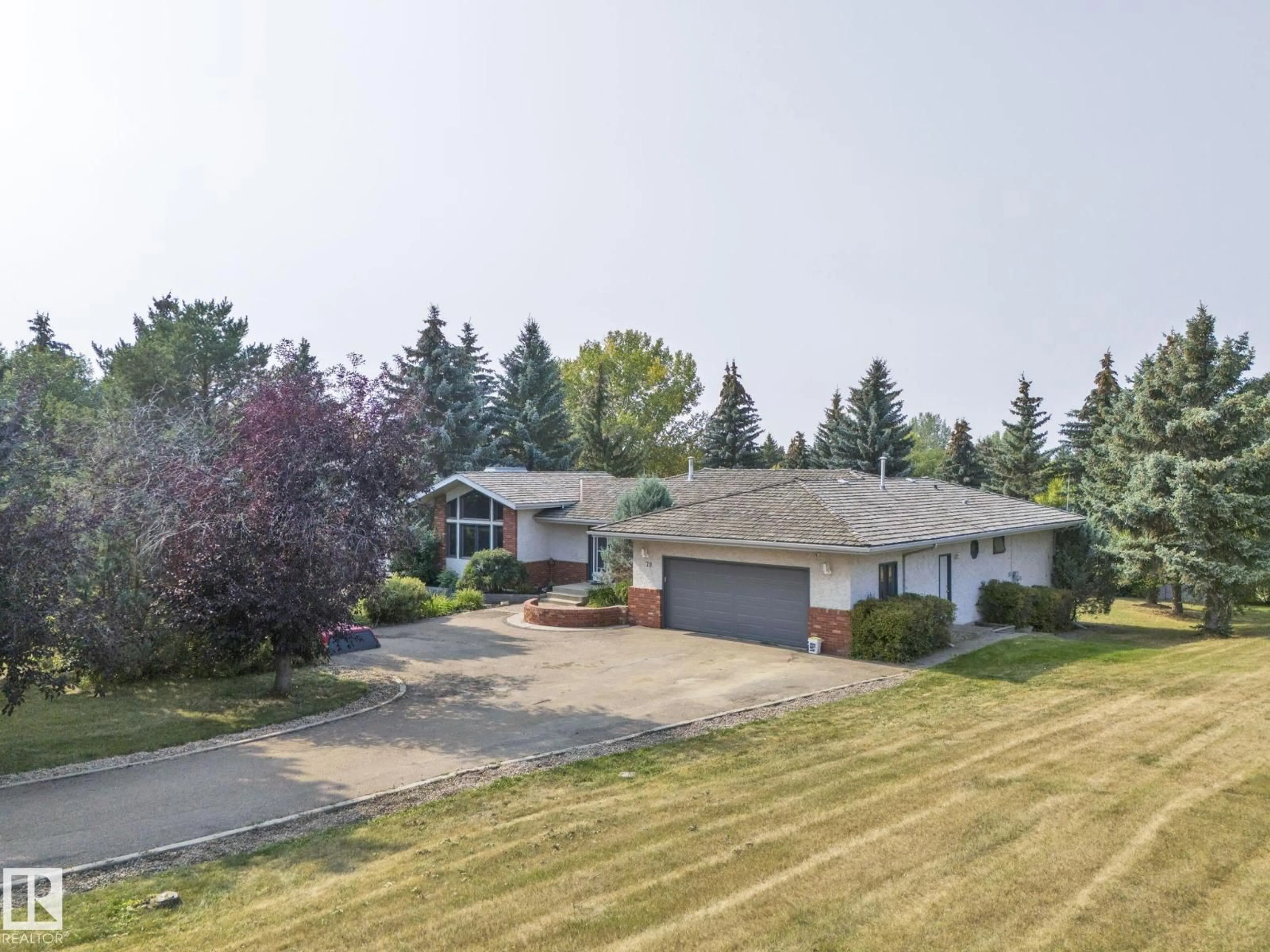A pic from outside/outdoor area/front of a property/back of a property/a pic from drone, unknown for 79 25112 TWP ROAD 542A, Rural Sturgeon County Alberta T8T0B2