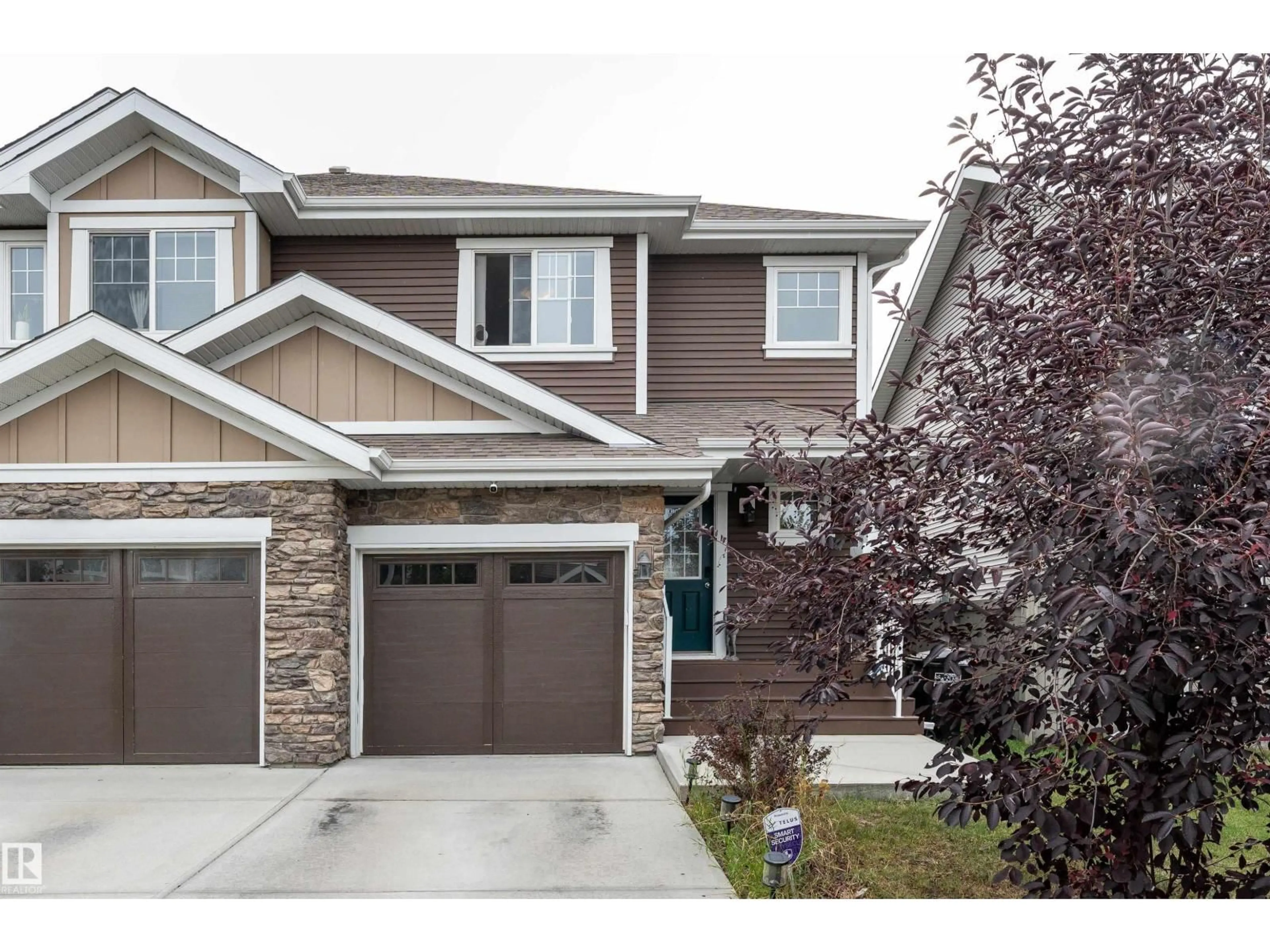 Home with vinyl exterior material, street for 521 EBBERS WY, Edmonton Alberta T5Y3T8