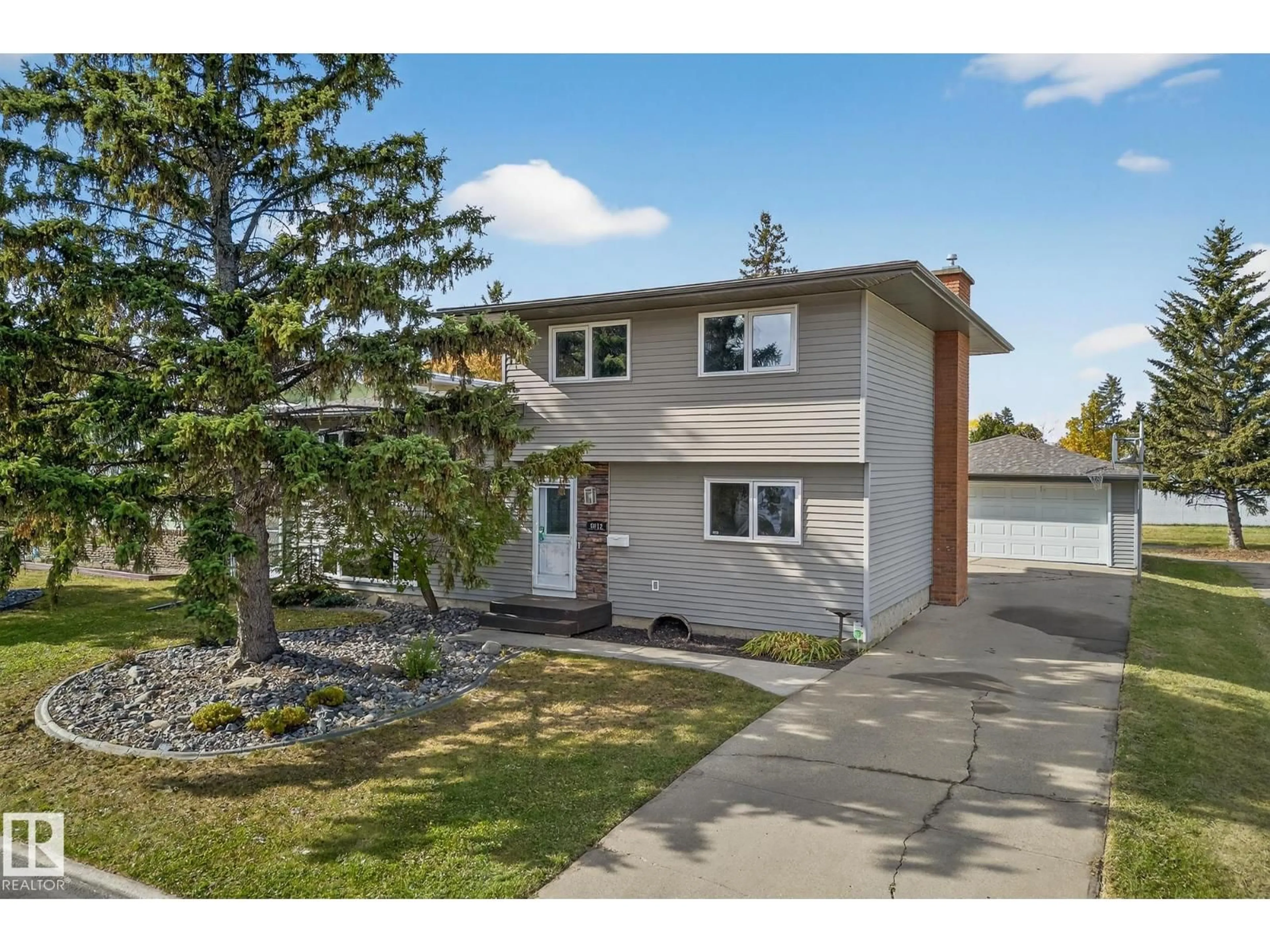 Home with vinyl exterior material, street for NW - 8012 172 ST, Edmonton Alberta T5T0C8