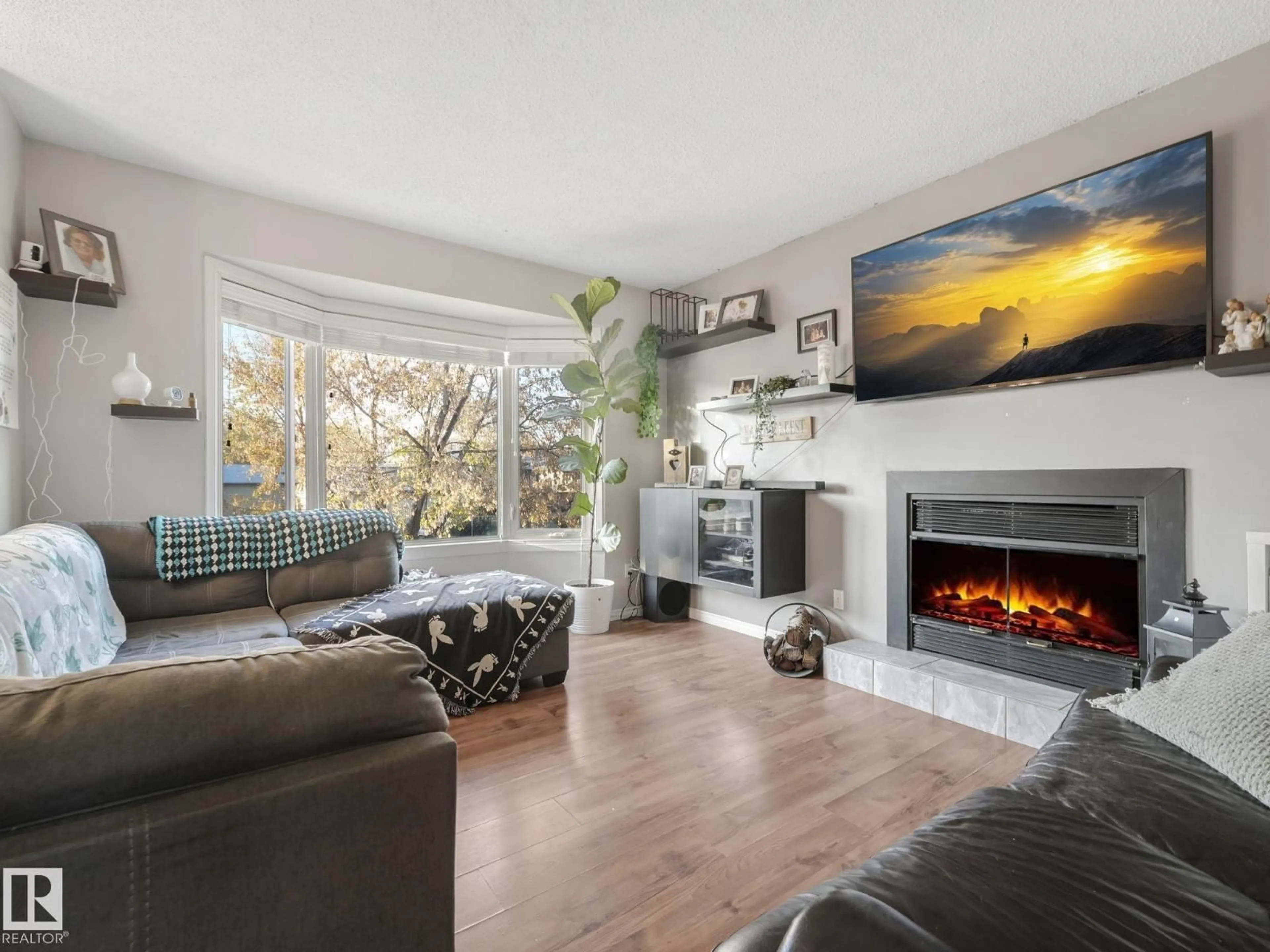 Living room with furniture, wood/laminate floor for 5006 51 AV, Calmar Alberta T0C0V0