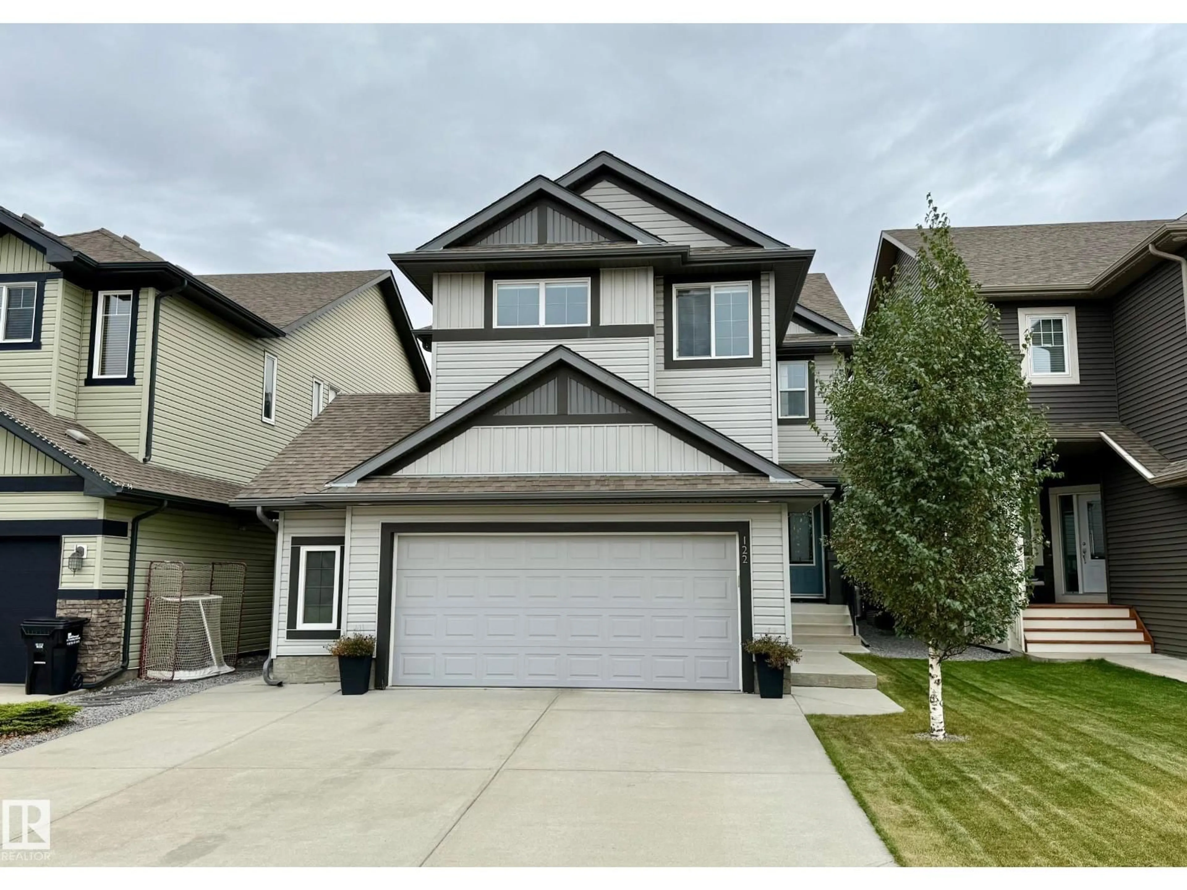 Home with vinyl exterior material, street for 122 SUNTERRA WY, Sherwood Park Alberta T8H0T8