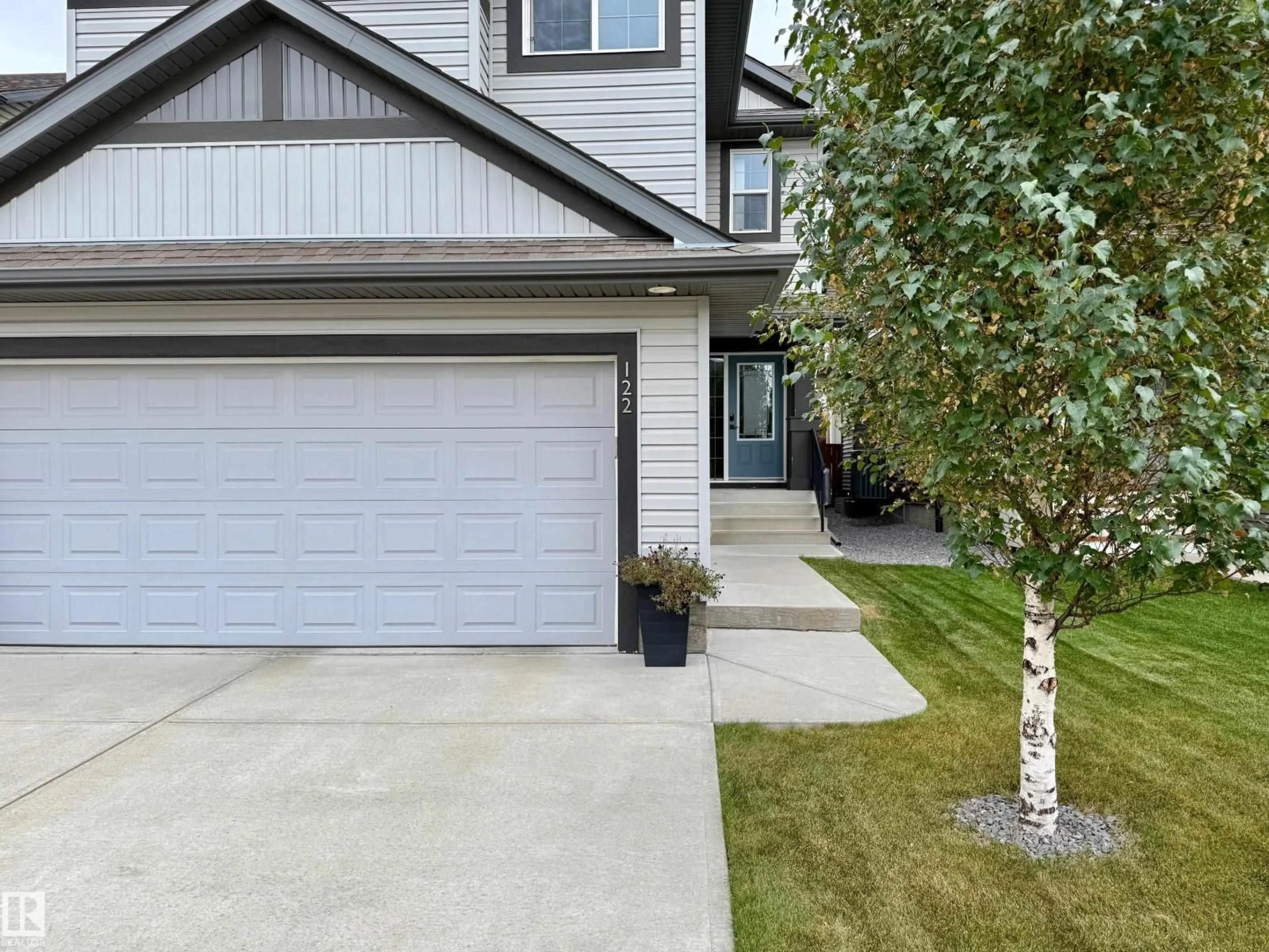 Home with vinyl exterior material, street for 122 SUNTERRA WY, Sherwood Park Alberta T8H0T8