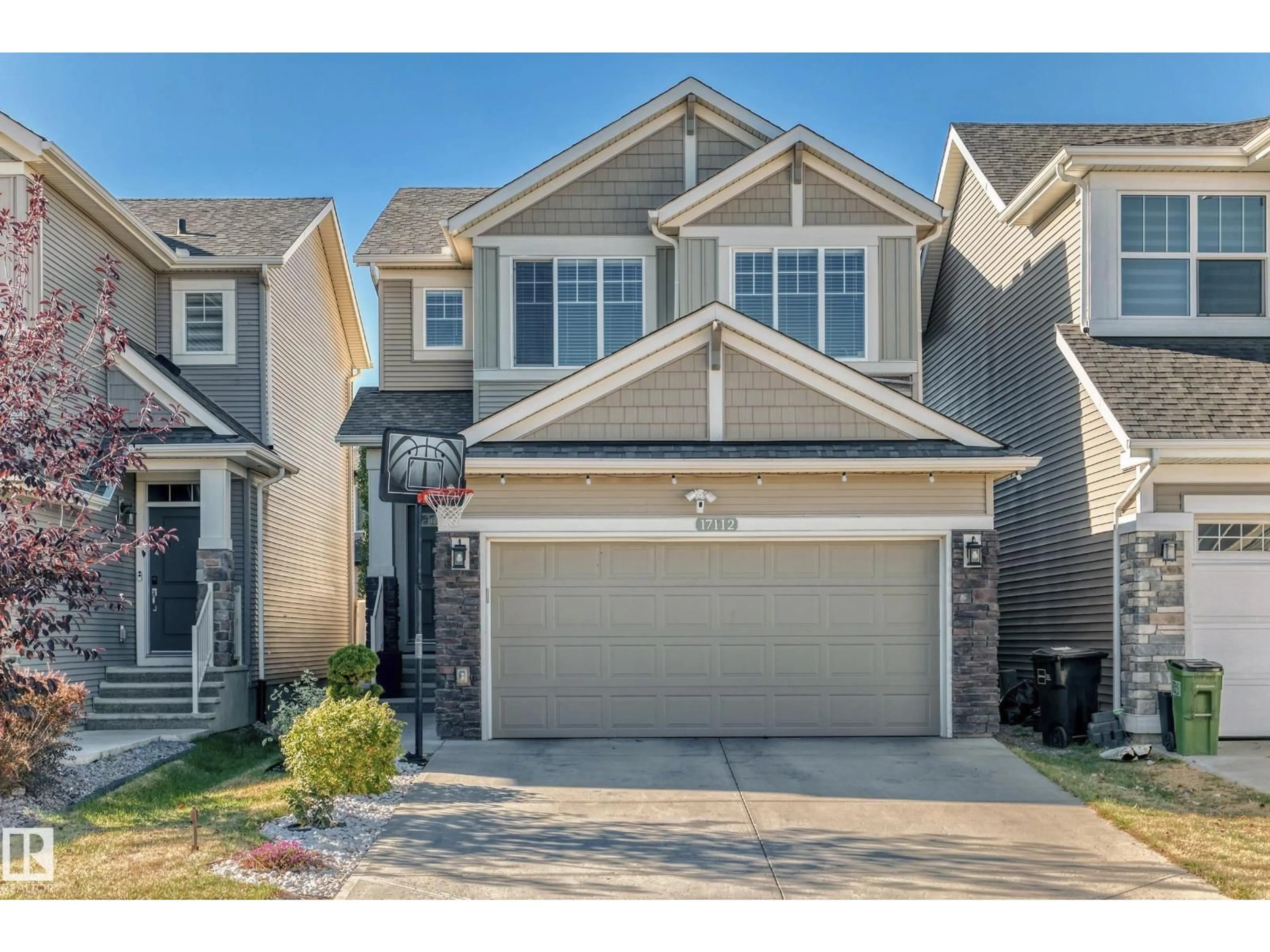 Home with vinyl exterior material, street for 17112 64 ST, Edmonton Alberta T5Y3P9